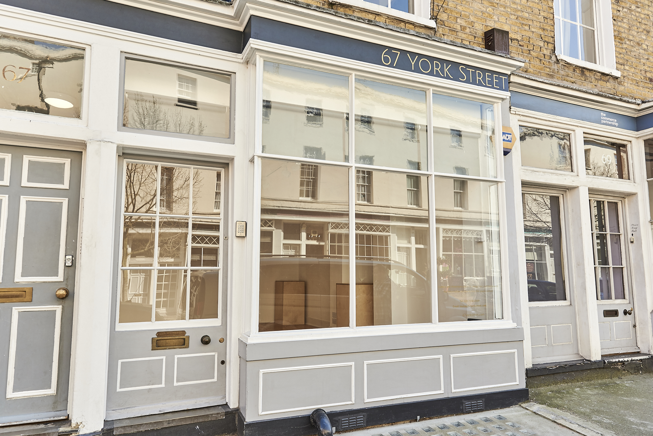 Versatile event space with large windows at 67 York Street Gallery, ideal for meetings.