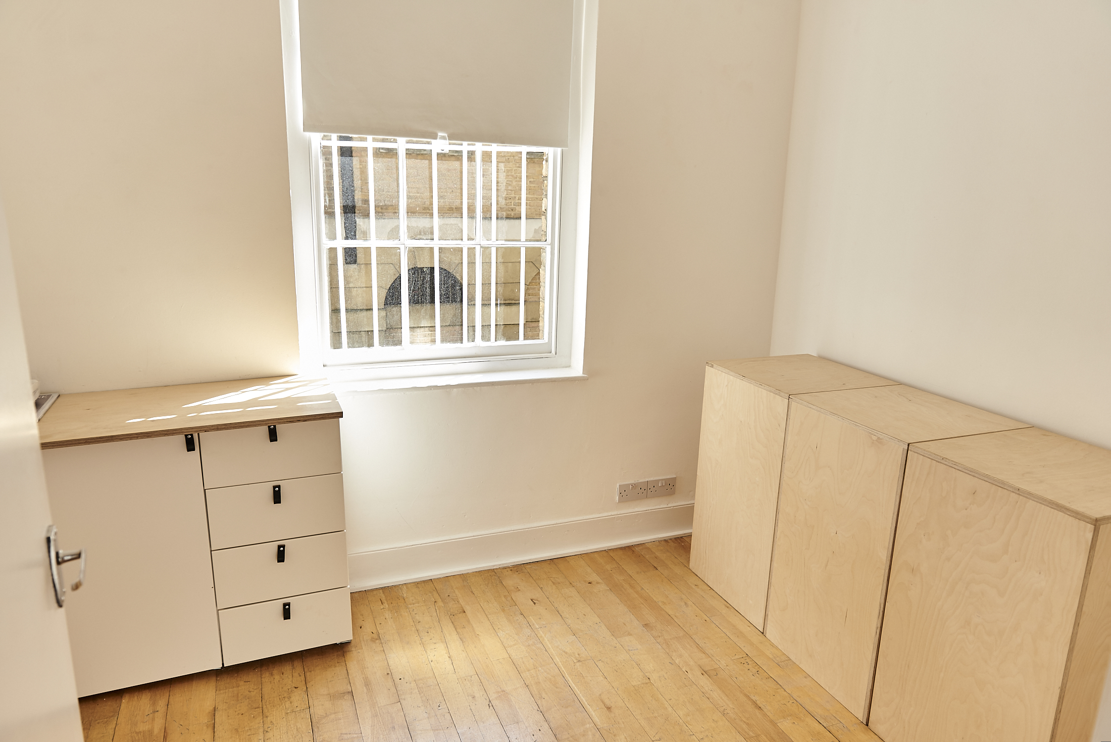 Minimalist meeting space with natural light at 67 York Street Gallery for versatile events.