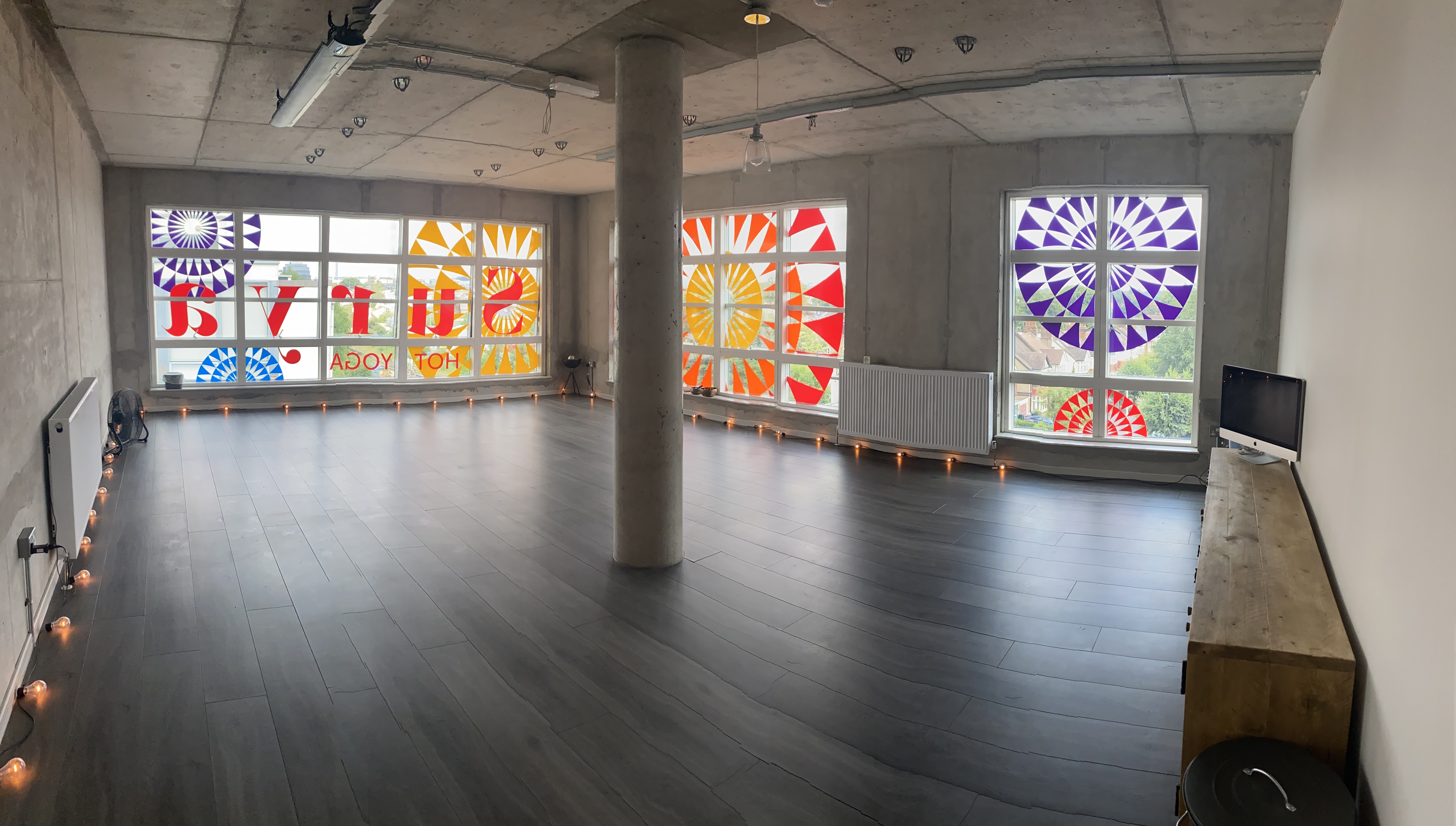 Spacious Surya Studio 2 with stained glass, perfect for workshops and networking events.