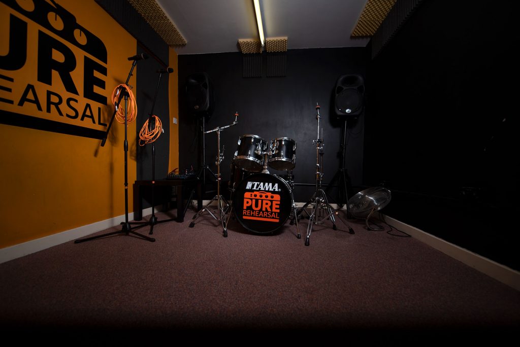 Rehearsal space with drum kit in Pure Rehearsal Studios for music events and band practice.