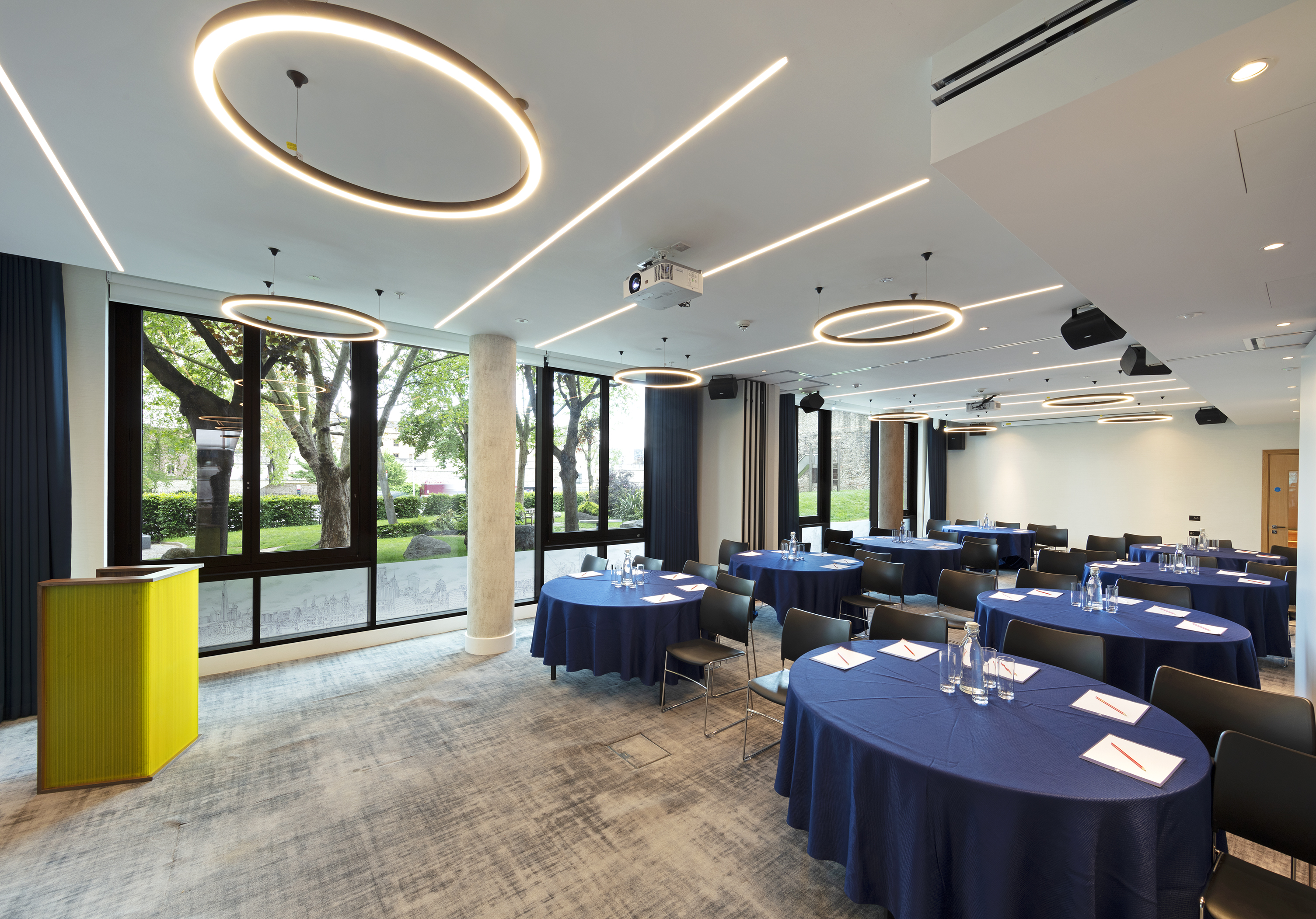 Royal Suite meeting space with navy tables, ideal for corporate events and workshops.