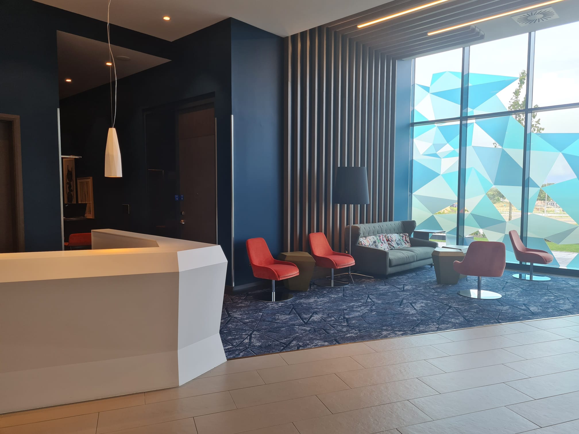 Modern Hilton Aberdeen TECA lobby with natural light, ideal for meetings and networking.
