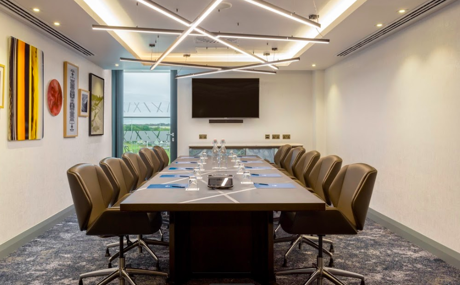 Modern conference room at Hilton Aberdeen TECA with ergonomic chairs for corporate events.