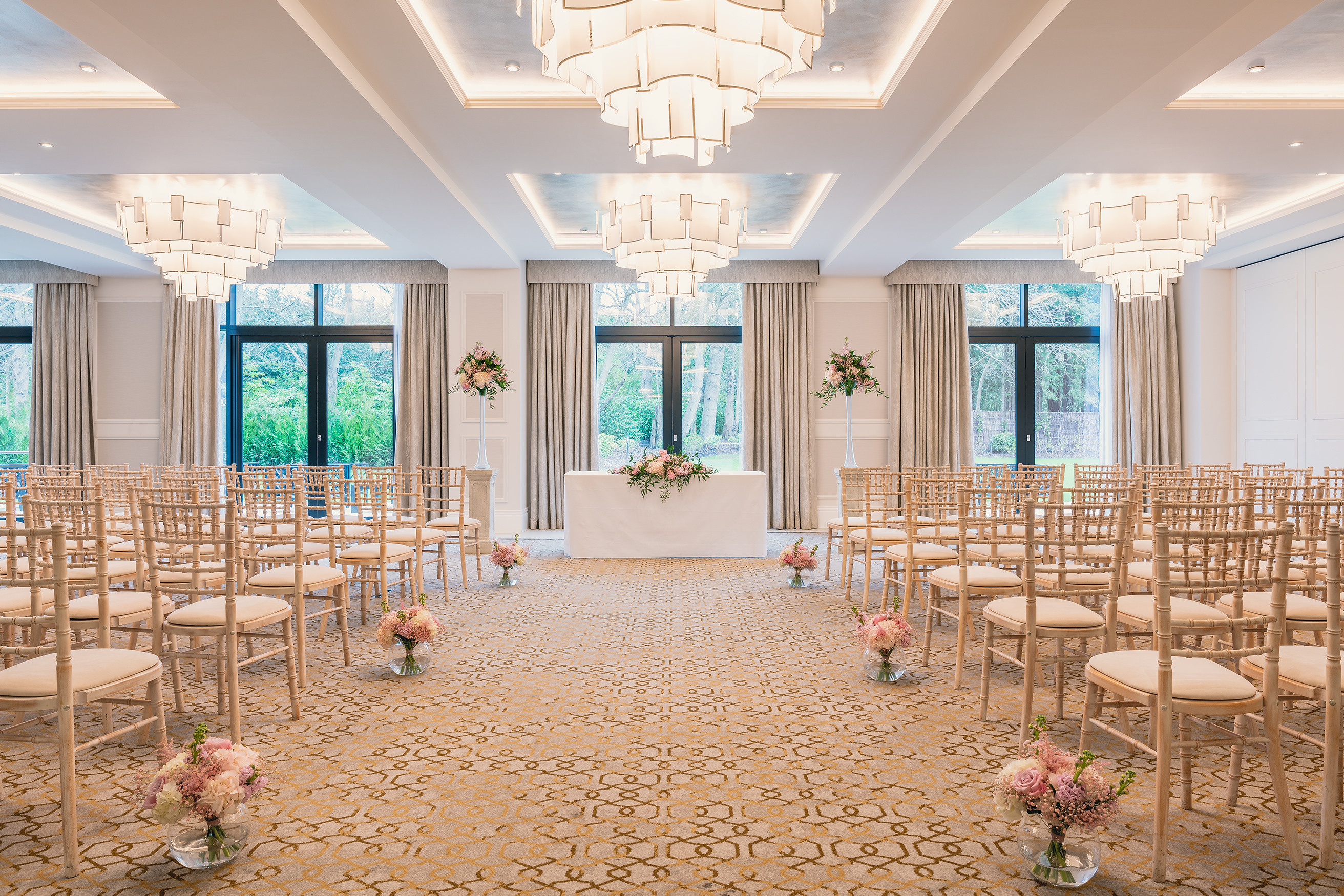 Monarch Suite at Fairmont Windsor Park, elegant wedding venue with chandeliers and floral decor.