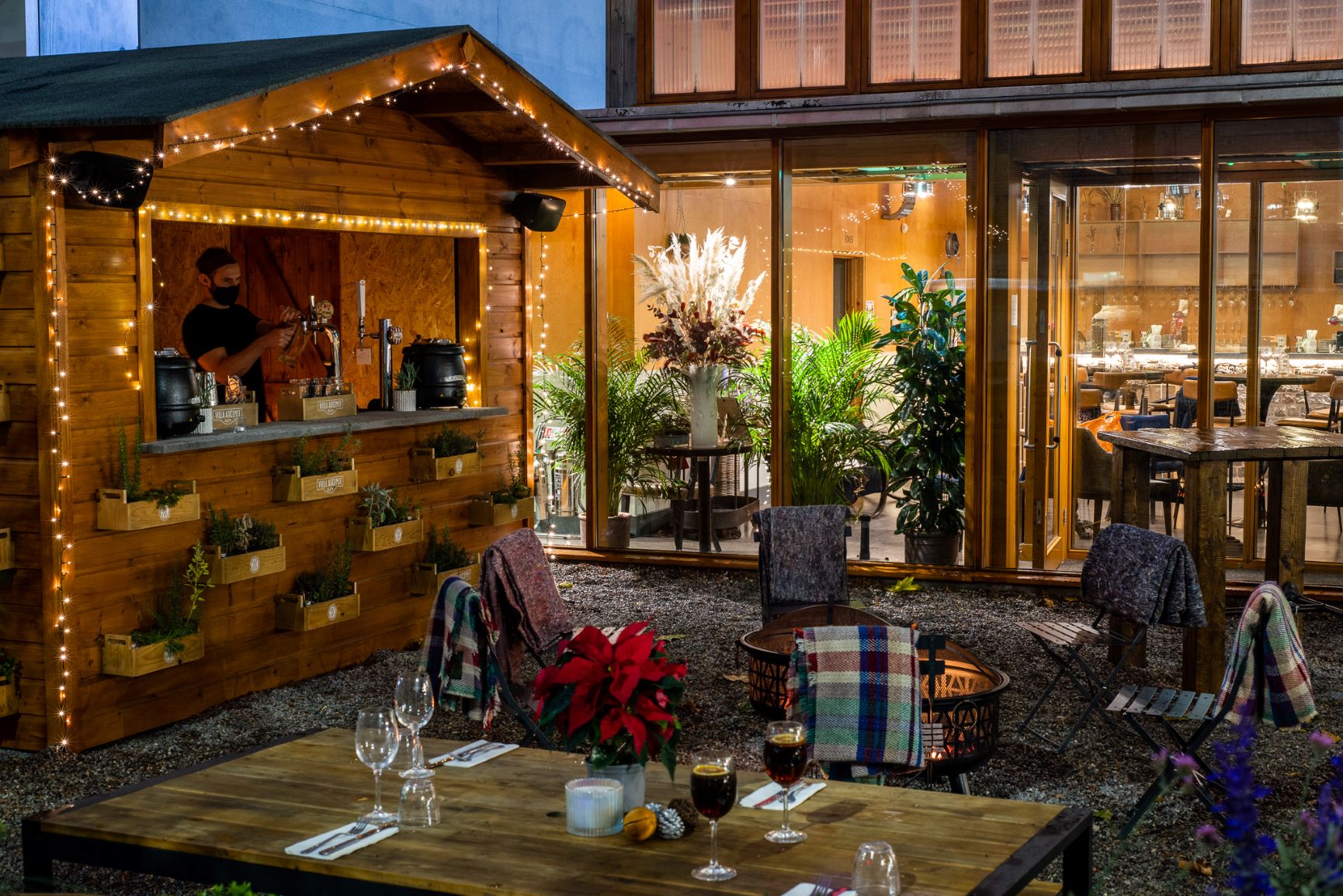 Charming outdoor bar with rustic wood, ideal for cocktail receptions and networking events.