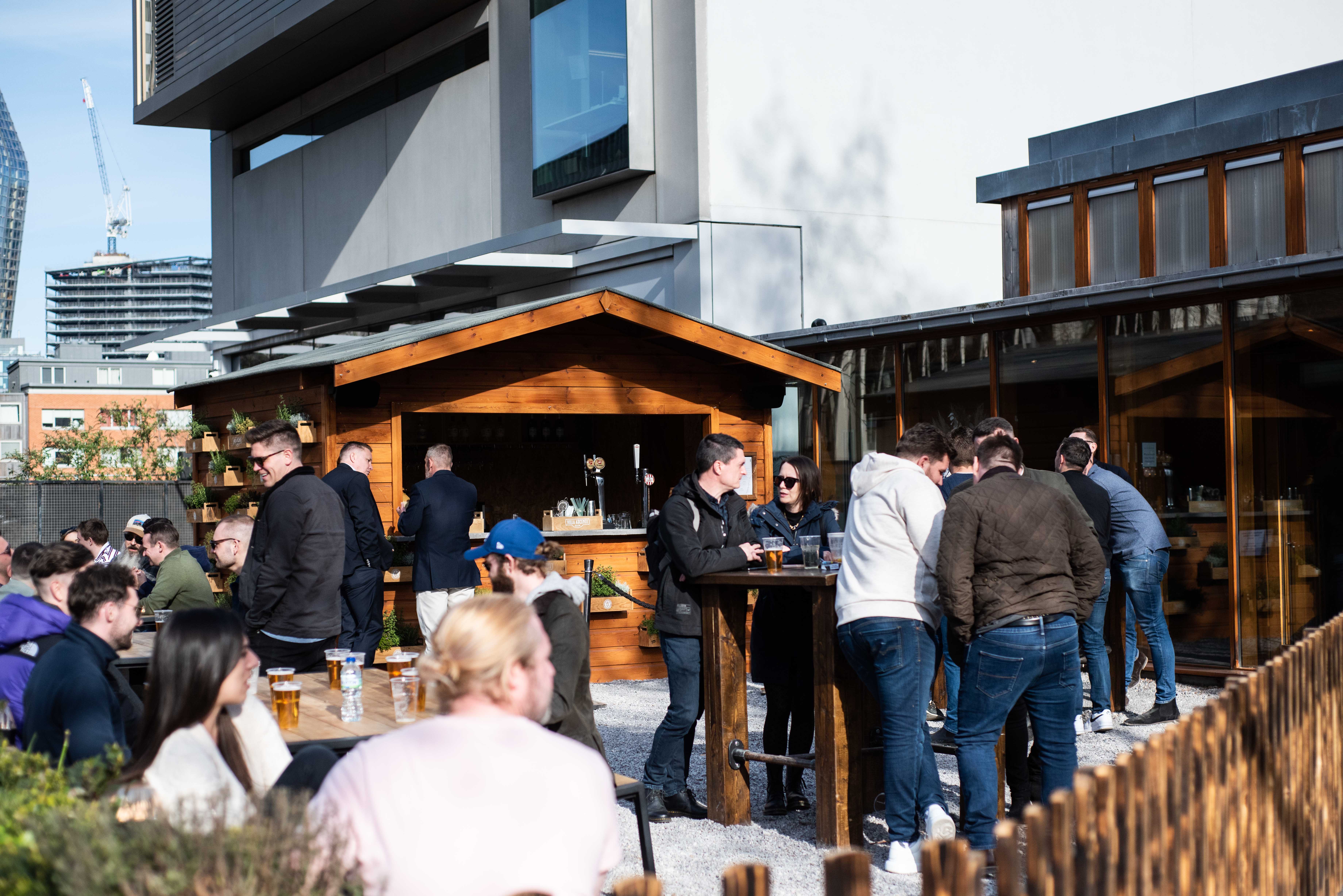 Vibrant outdoor bar in The Greenroom, ideal for networking and social gatherings.