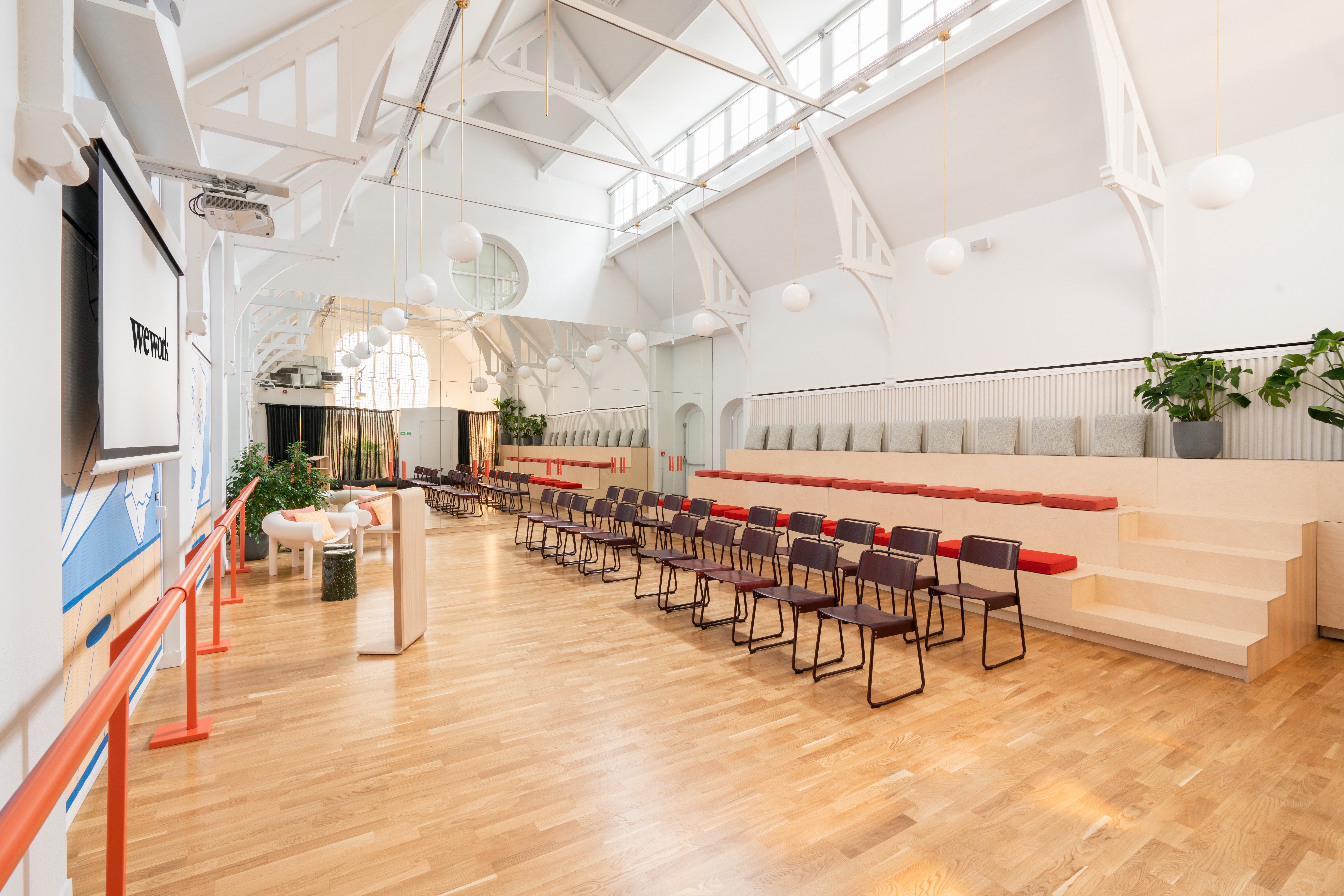 Versatile event space with natural light for corporate meetings and creative workshops.
