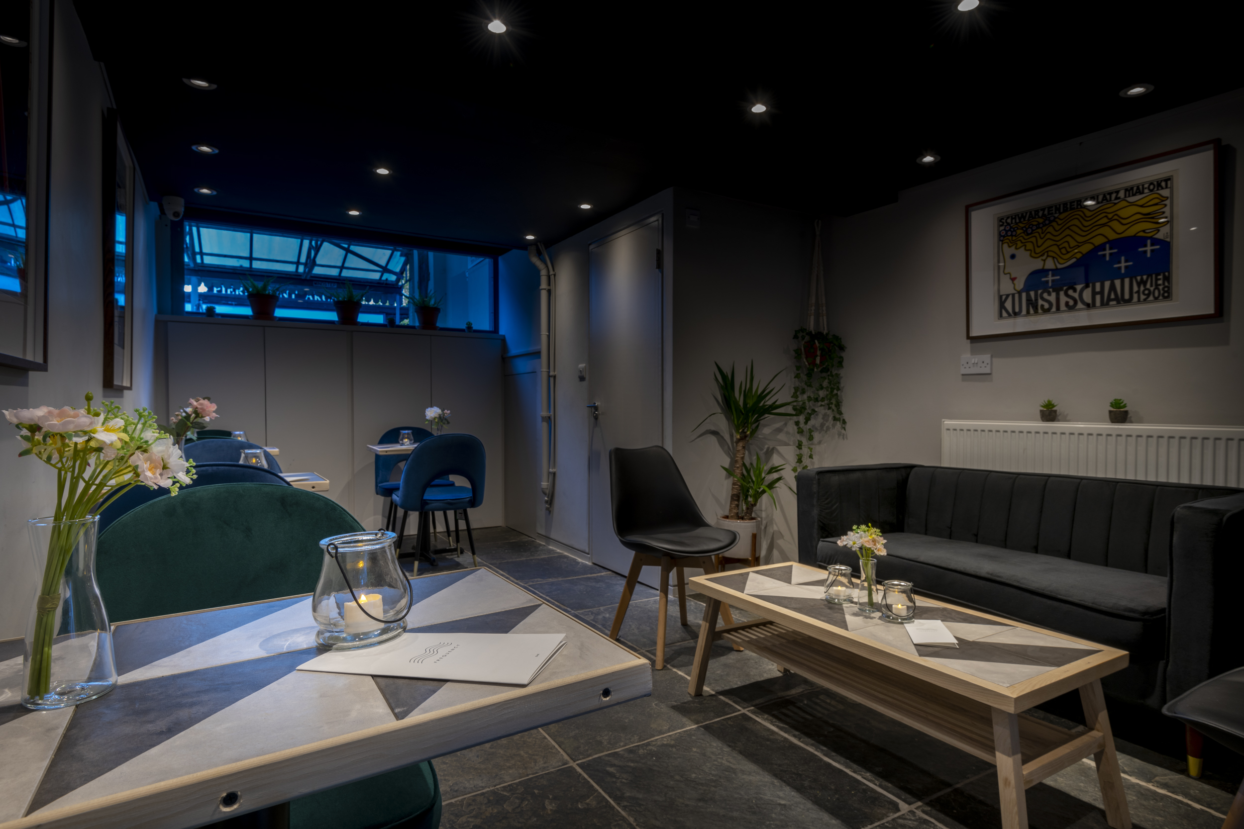 Modern Frequency Cocktail Bar with soft lighting, perfect for intimate gatherings and workshops.