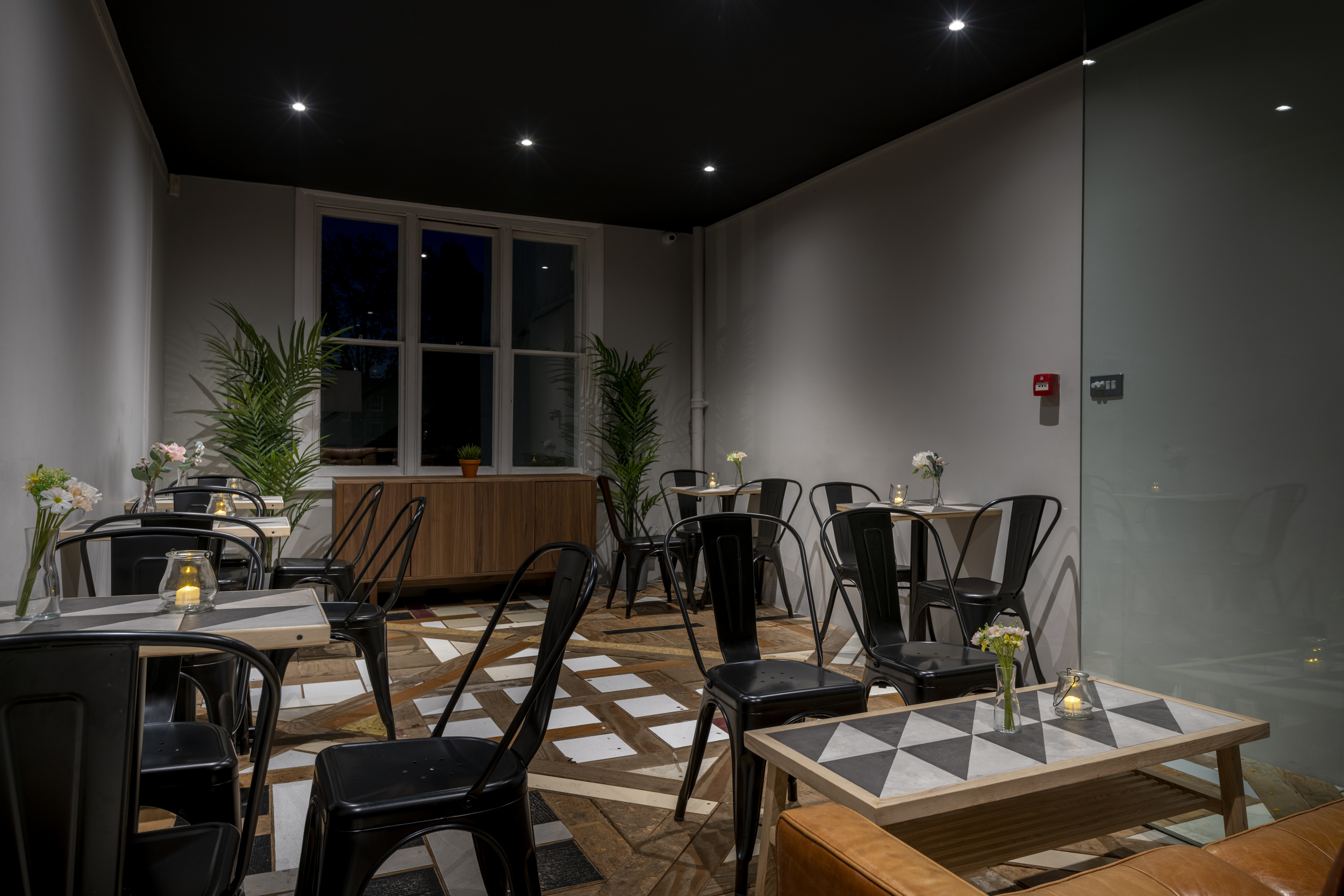 Modern Frequency Cocktail Bar with minimalist decor, perfect for intimate events and networking.