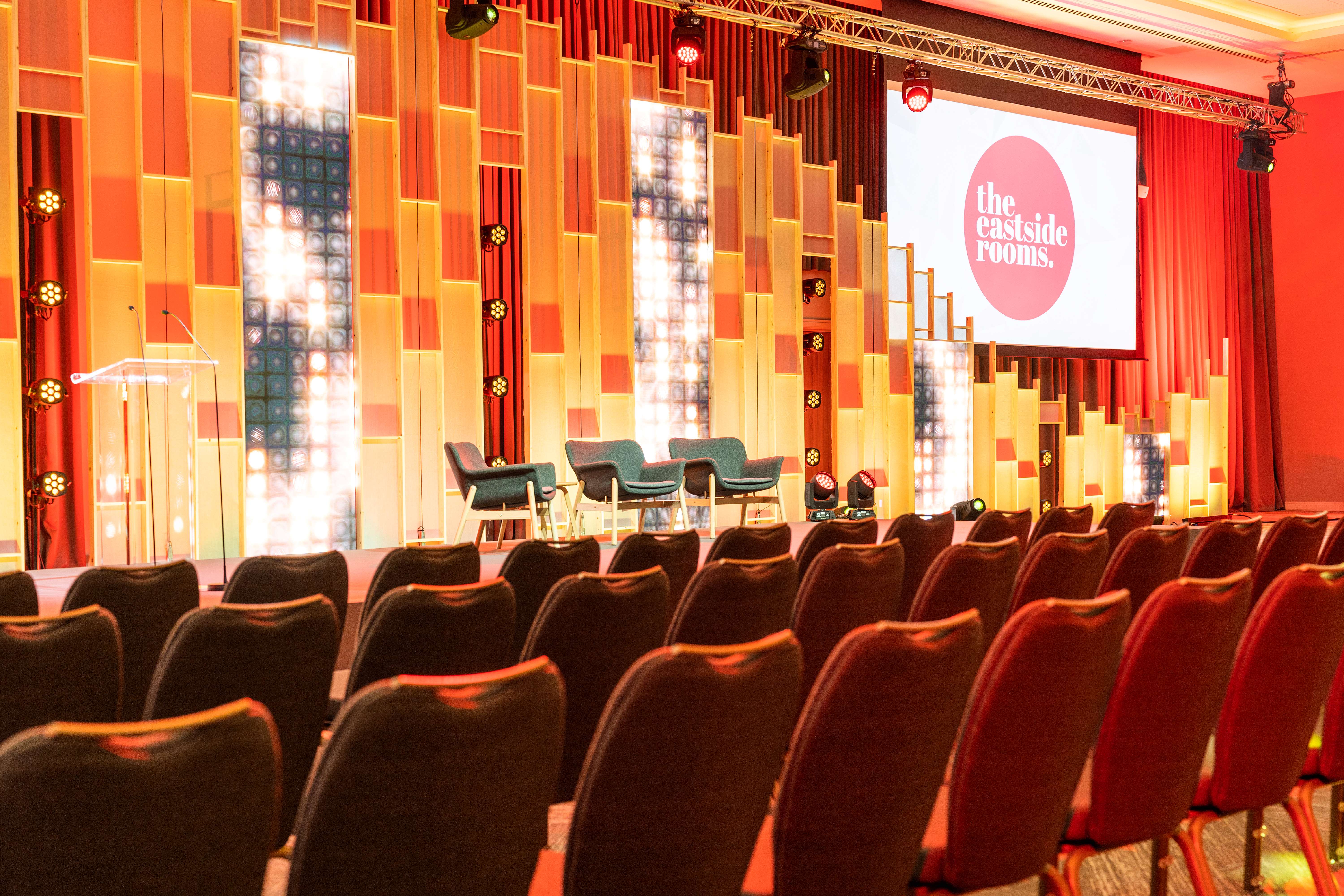 Modern event space Affinity Two with vibrant lighting, perfect for conferences and discussions.