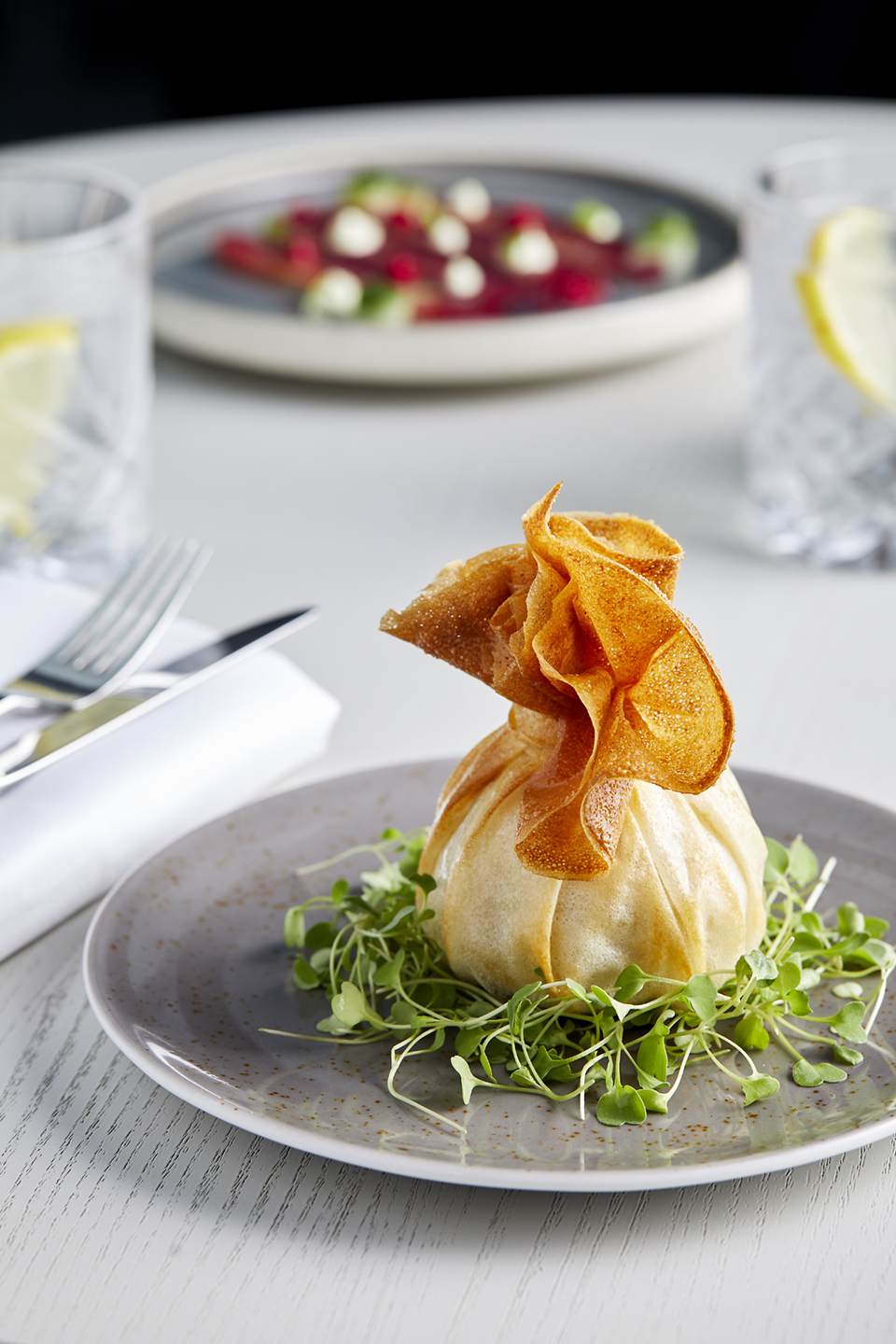 Elegant pastry pouch with crispy topping for upscale catering at corporate events.