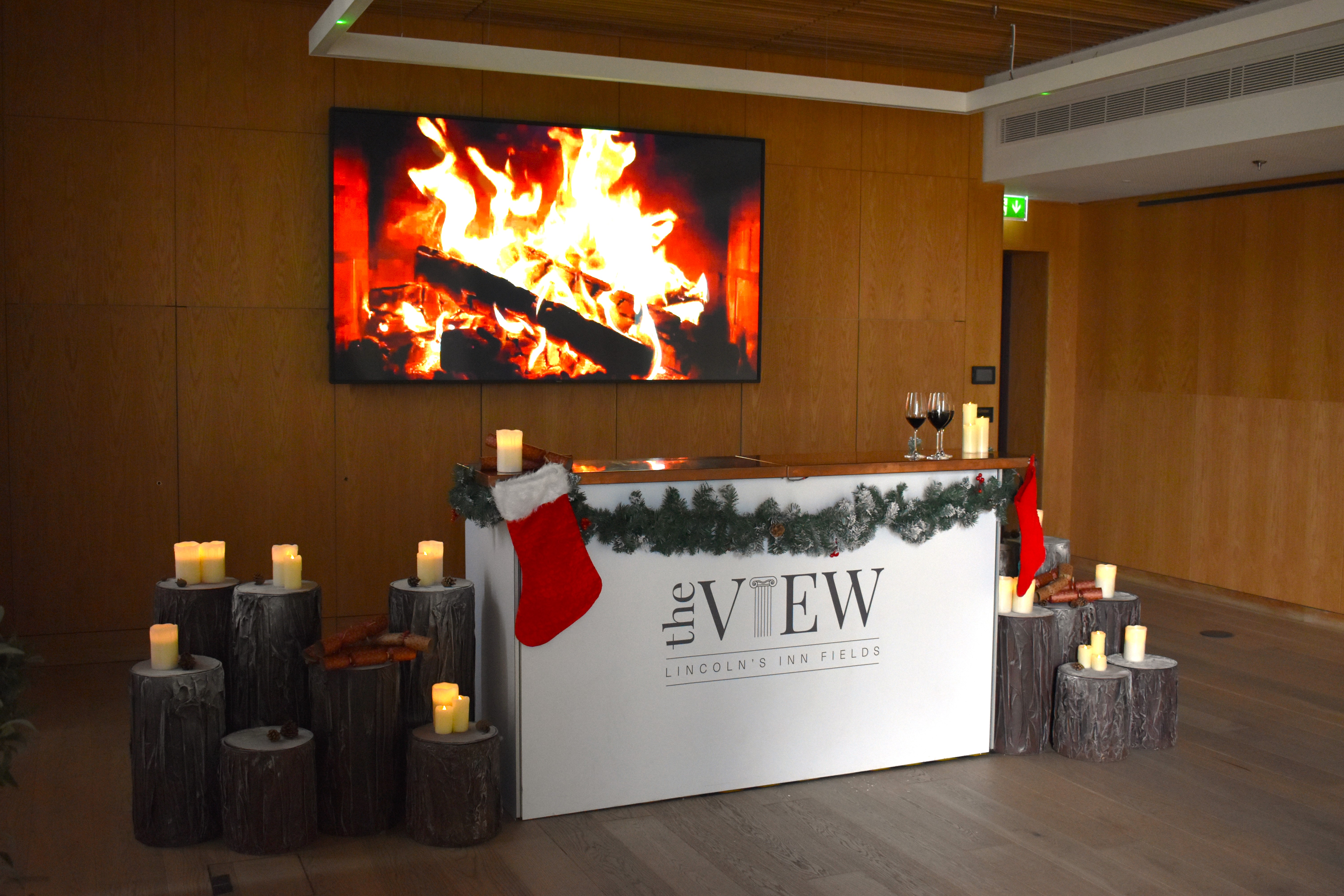 Winter holiday bar with fireplace, event reception lounge