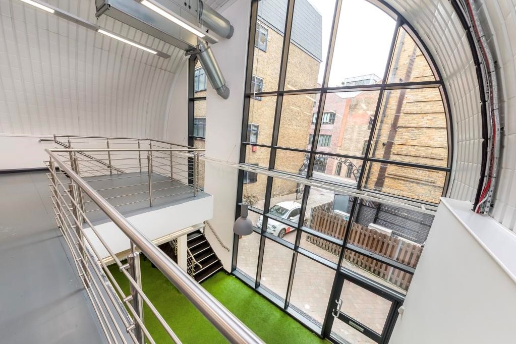 Modern event space Arch 29 with large windows, ideal for corporate and creative events.