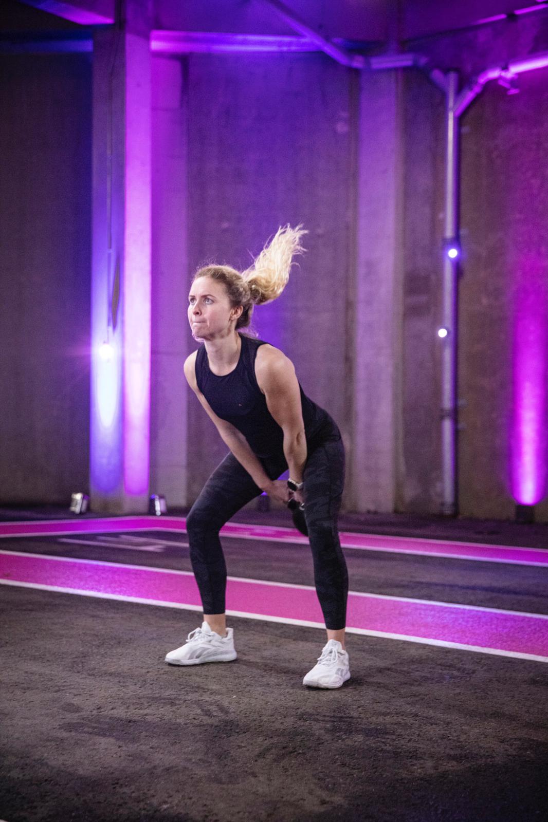Dynamic fitness session at Pink Coach Park, Wembley Park for corporate wellness events.