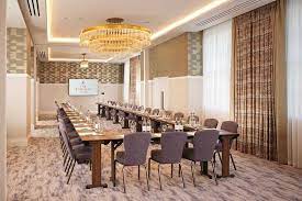 Manhattan Suite meeting room at The Biltmore Mayfair, elegant table for corporate events.