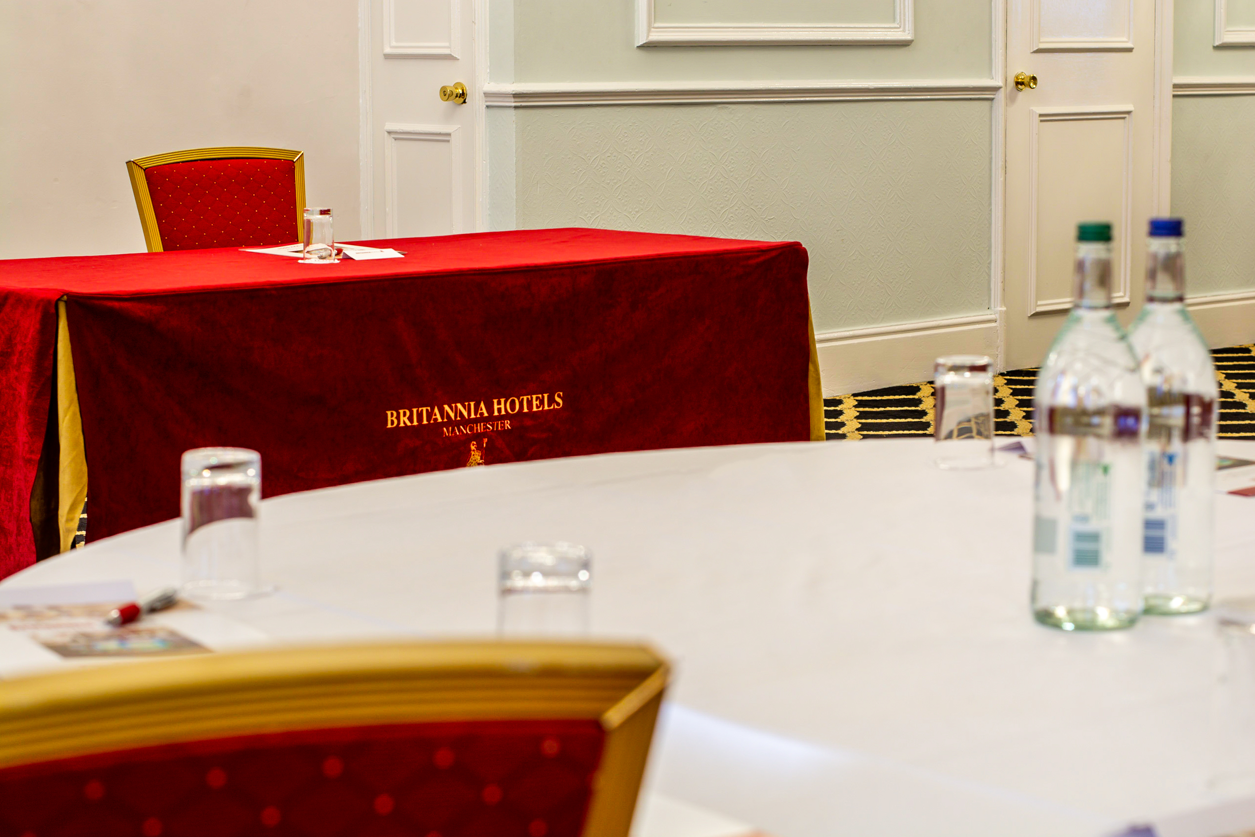 Crystal Suite at Britannia Hotel Manchester, round table setup for corporate events.