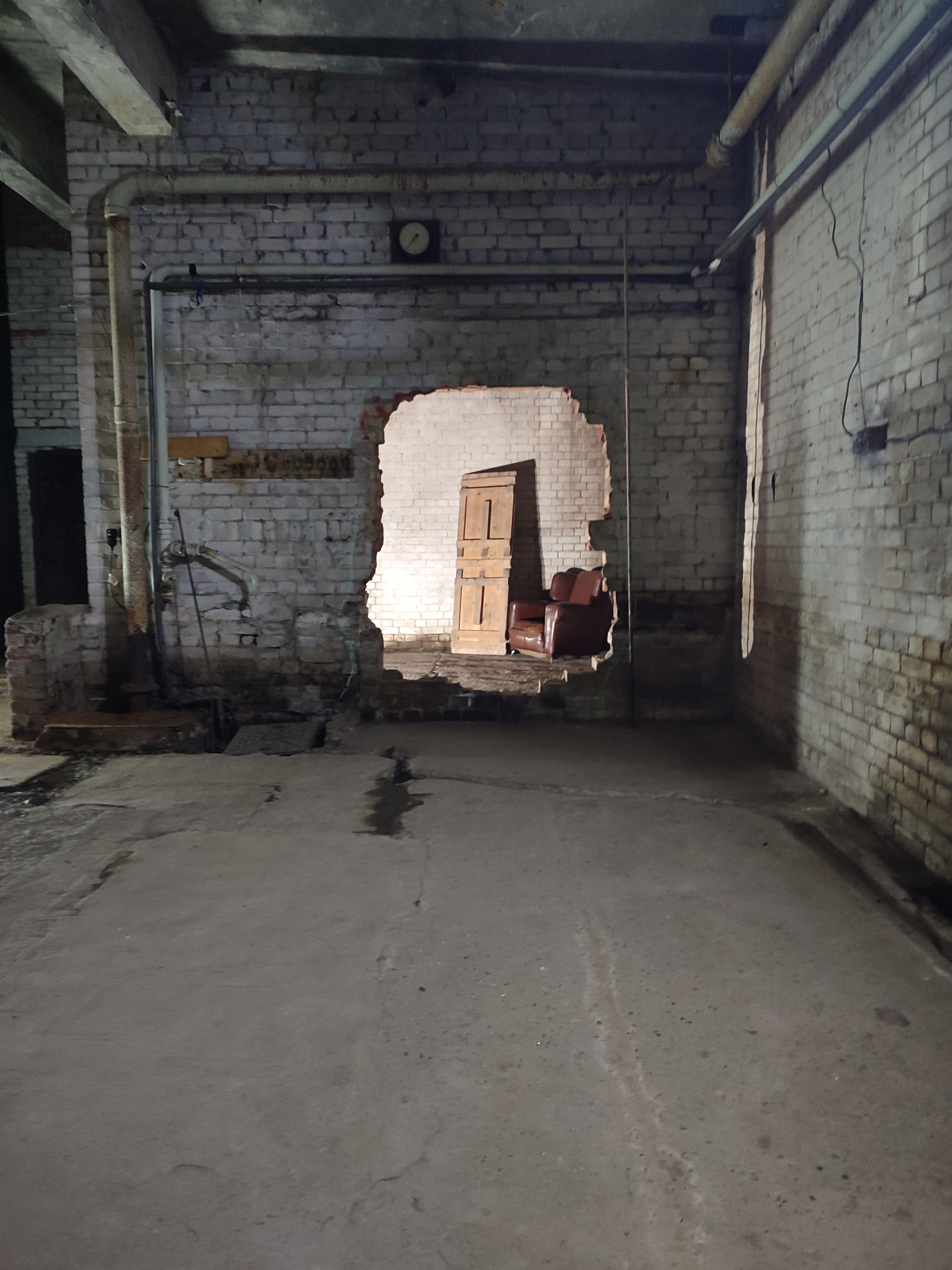 Empire Film Studios venue with exposed wall, ideal for creative events and gatherings.