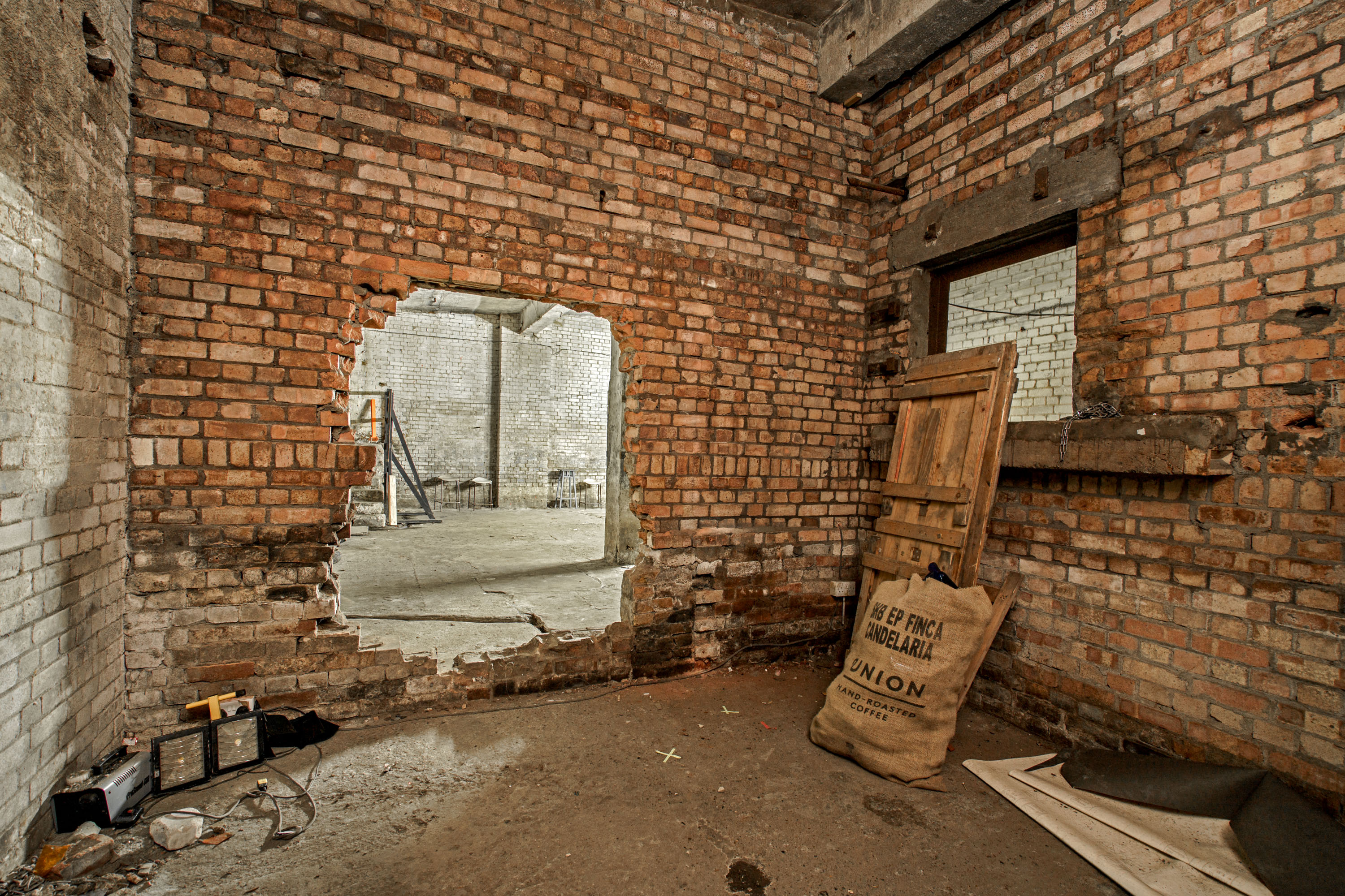 Empire Film Studios' raw industrial space with exposed brick for unique events.