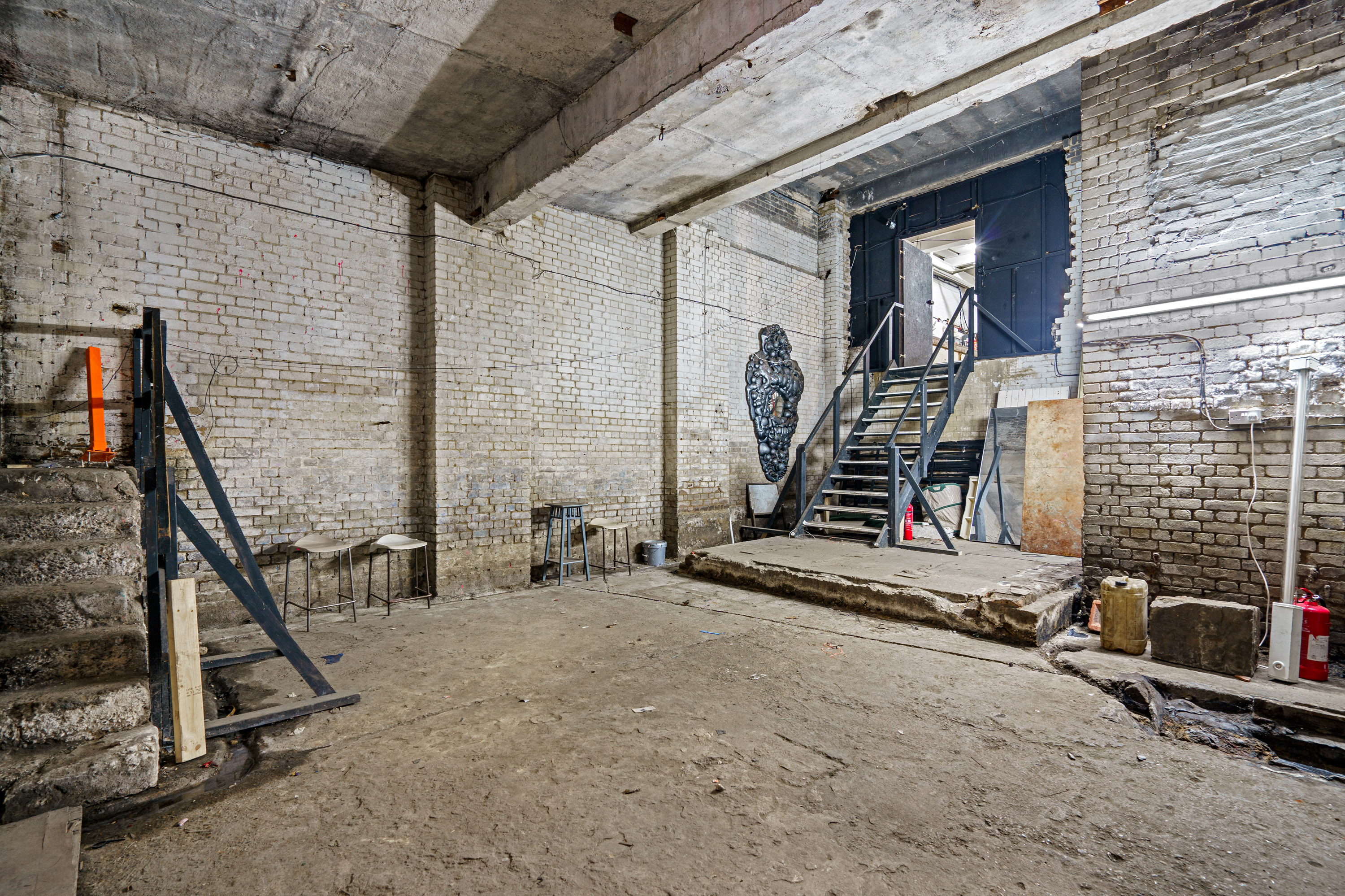 Empire Film Studios: industrial space with exposed brick for creative events and showcases.
