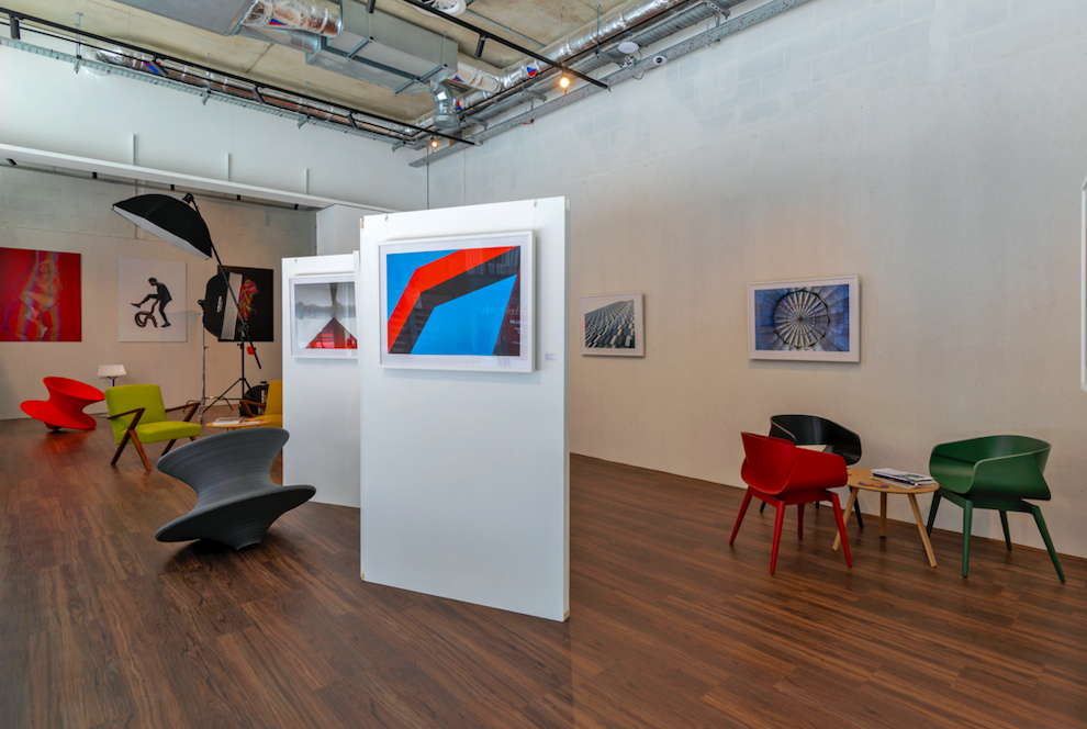 Modern event space in London with colorful furniture, ideal for art exhibitions and workshops.