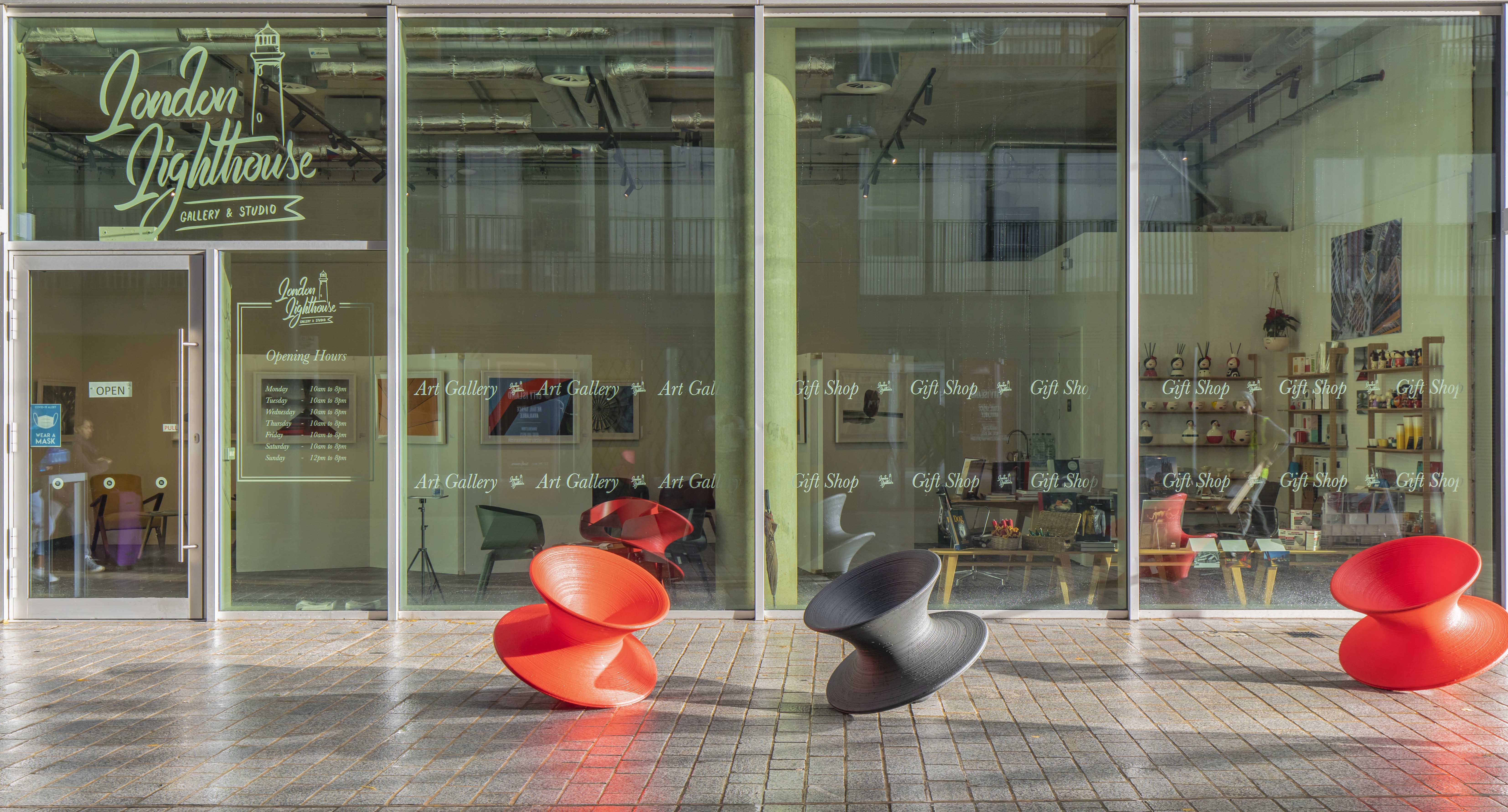 Modern event space with large windows at London Lighthouse Gallery for exhibitions and workshops.