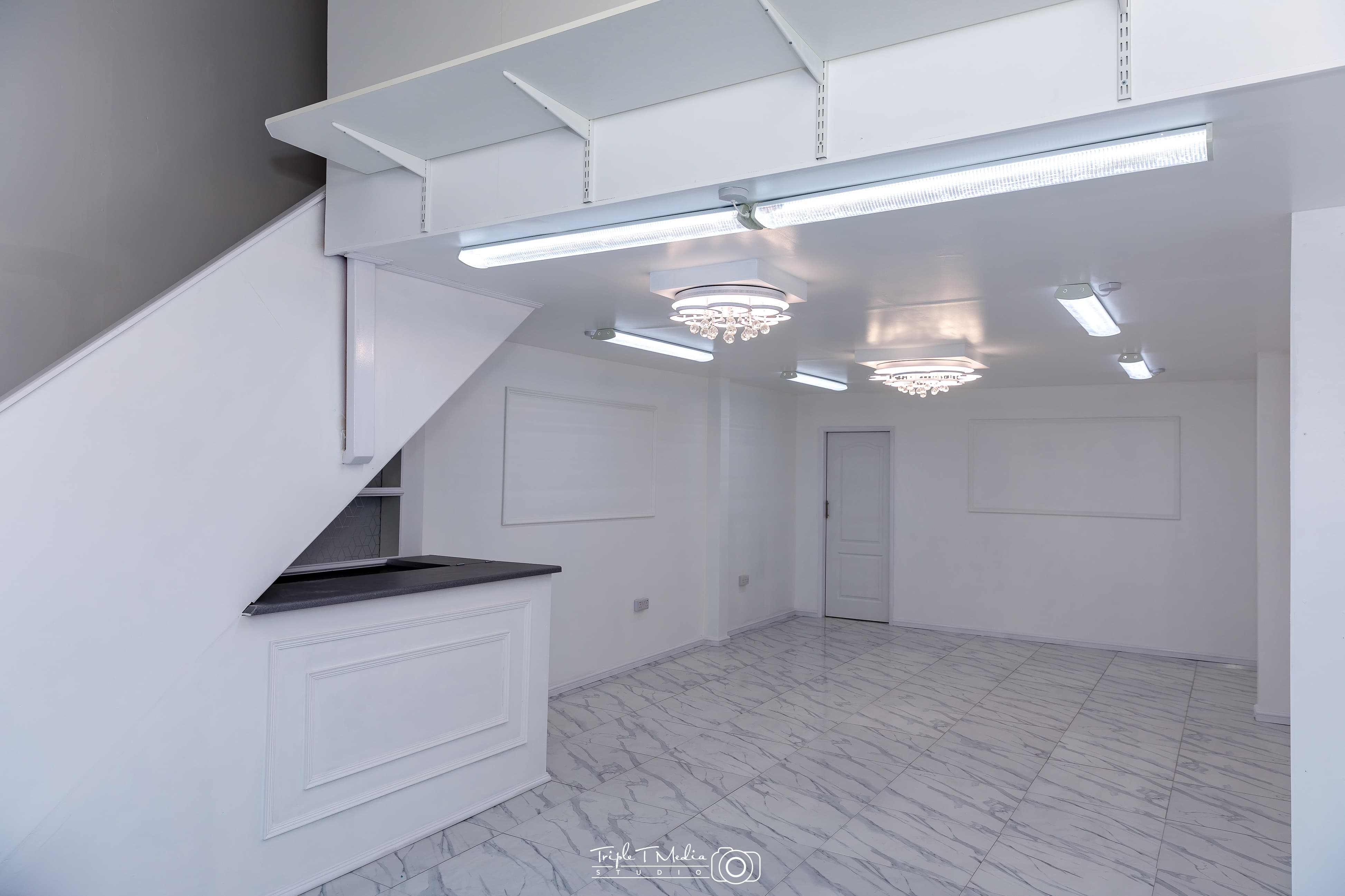 Modern event space with elegant chandeliers for corporate meetings and social gatherings.