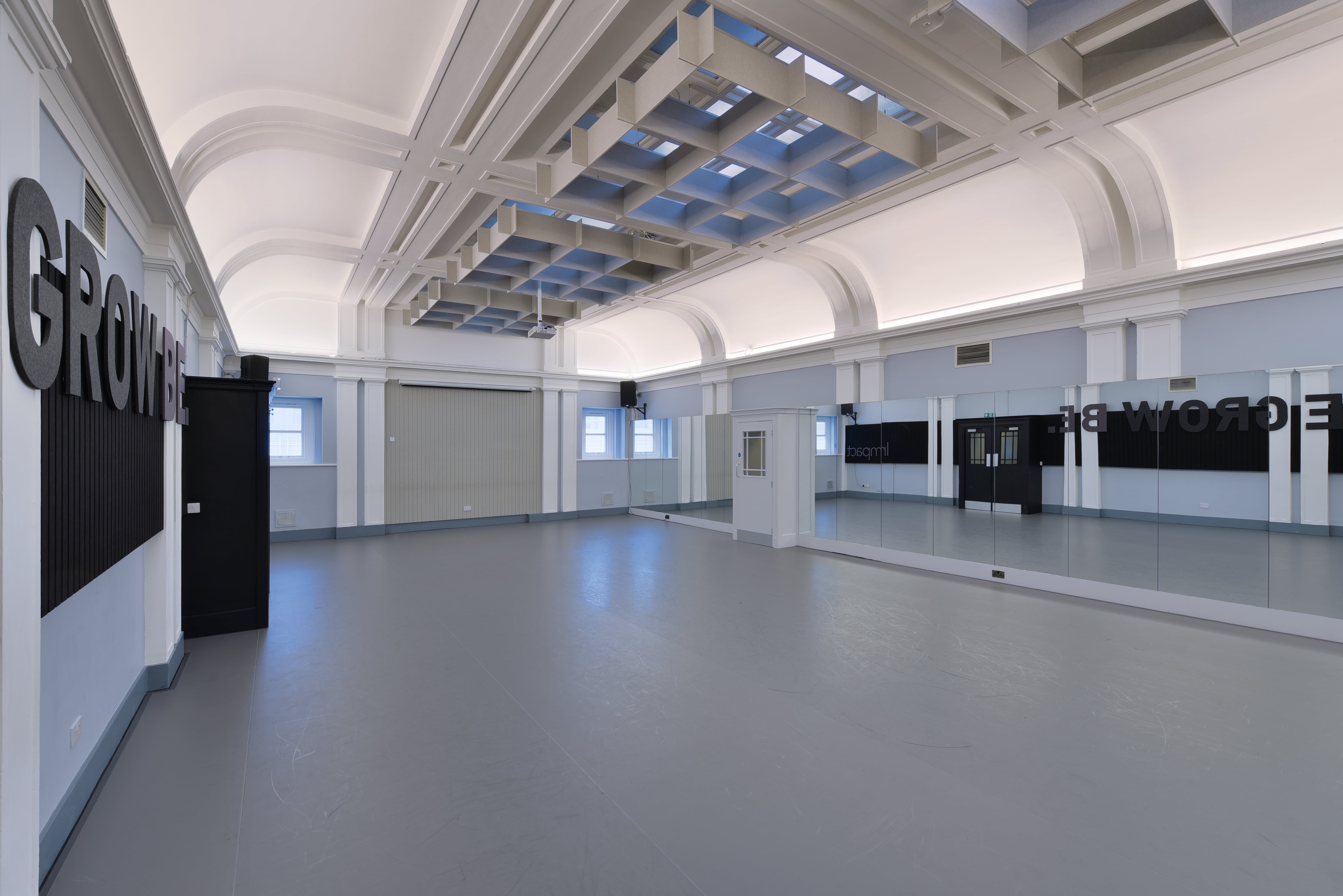 Spacious event venue with high ceilings, ideal for workshops and meetings at Impact Dance Studio.
