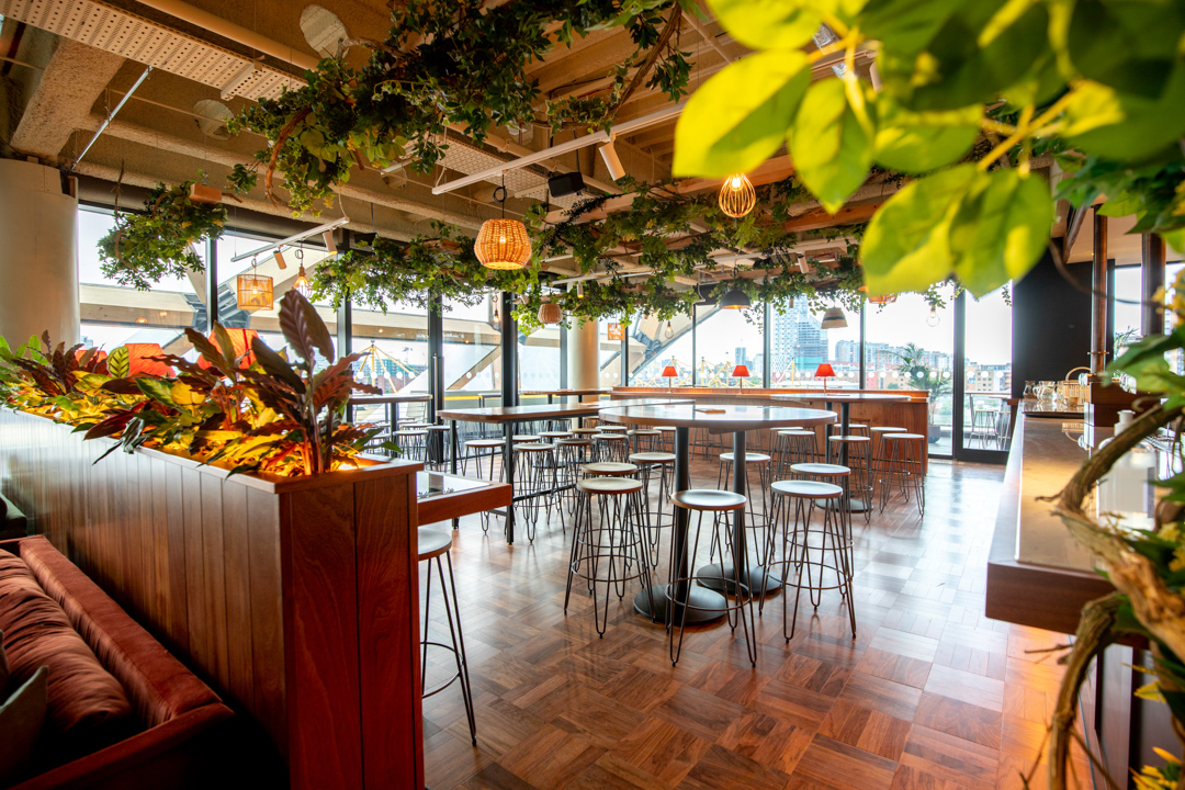 Stylish Billingsgate event space with greenery, ideal for gatherings and formal events.