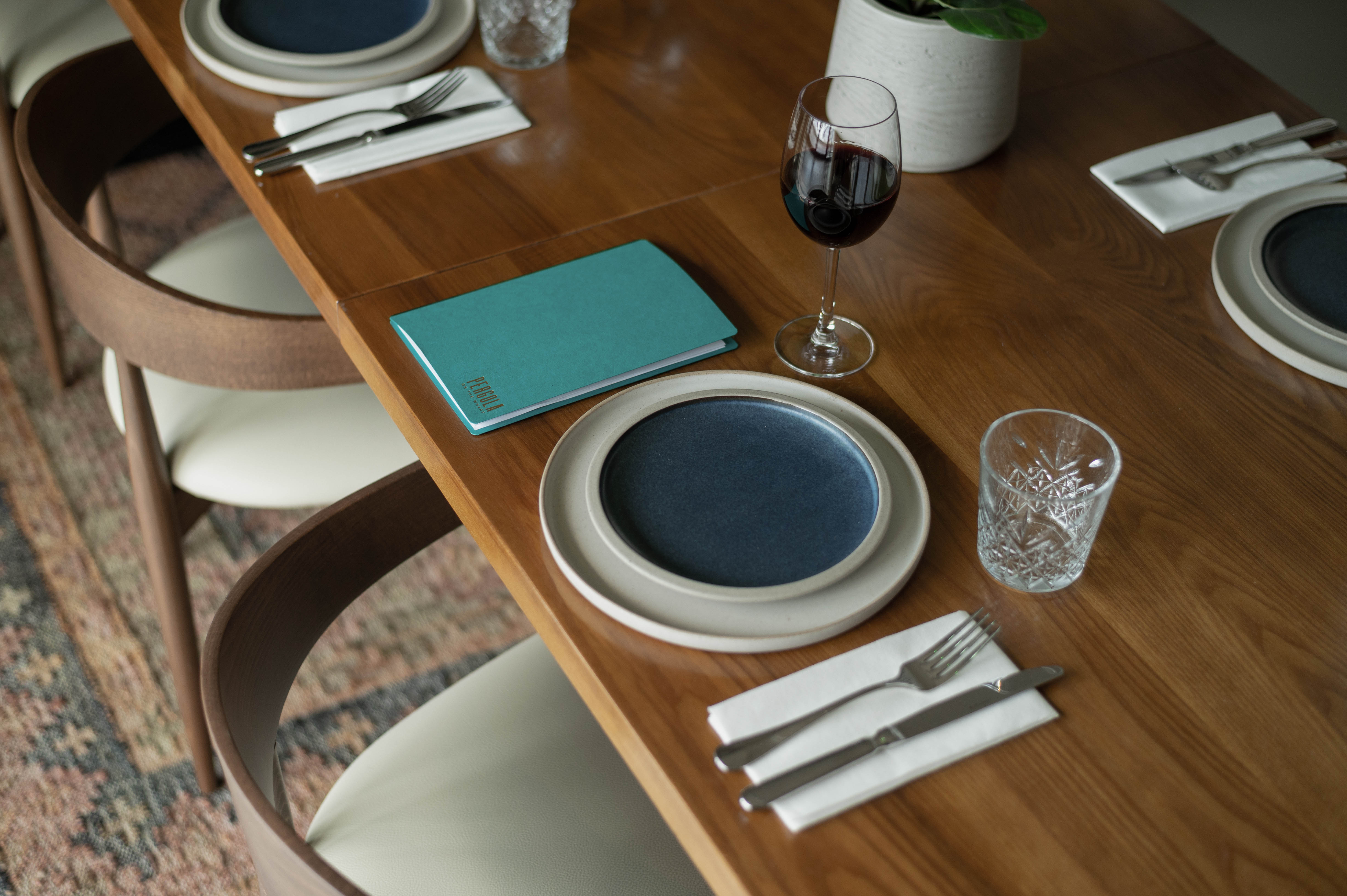 Private dining room with elegant table setting for upscale meetings and networking events.