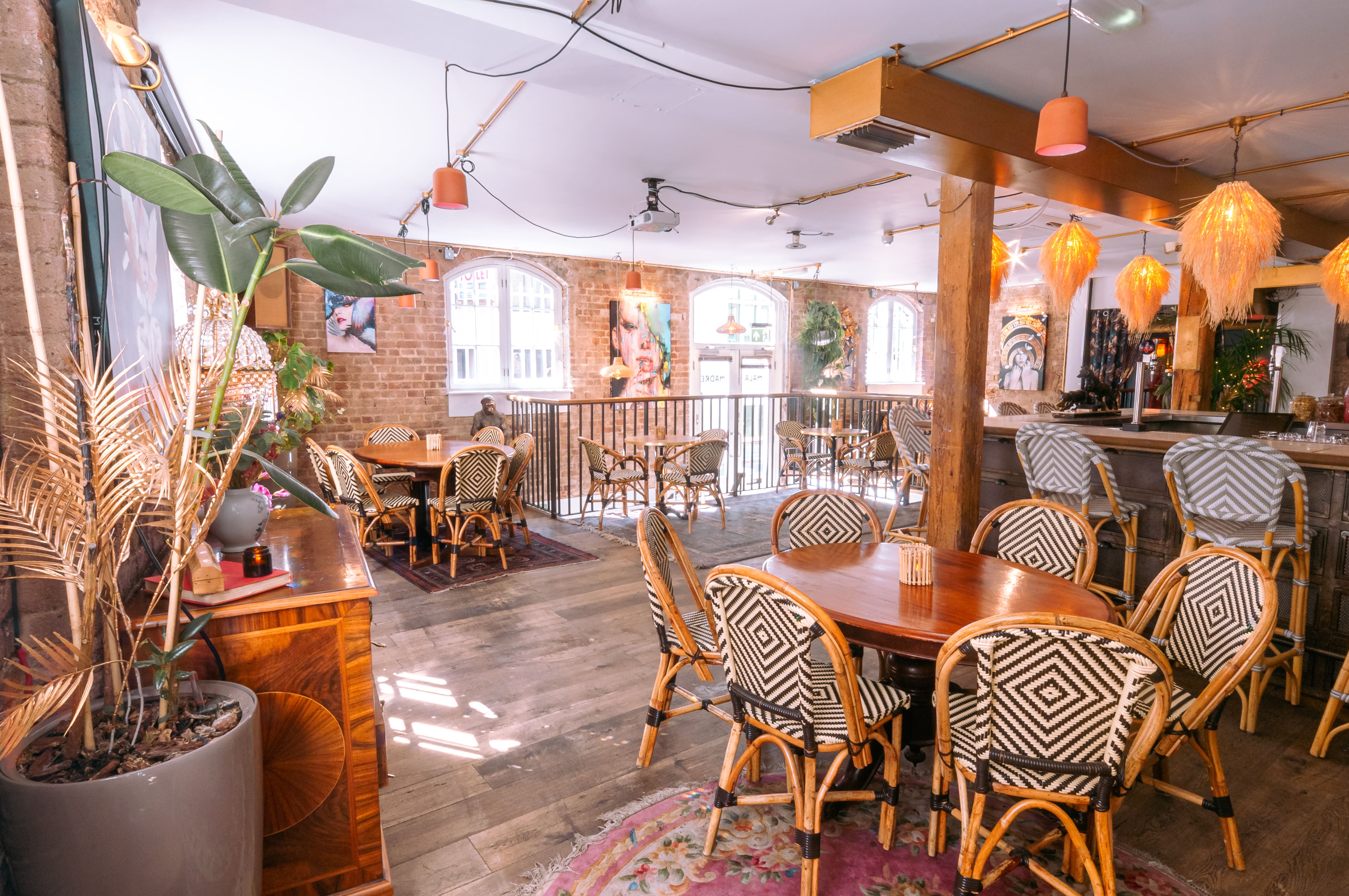 Mala Madre event space with warm decor, ideal for networking and celebrations.