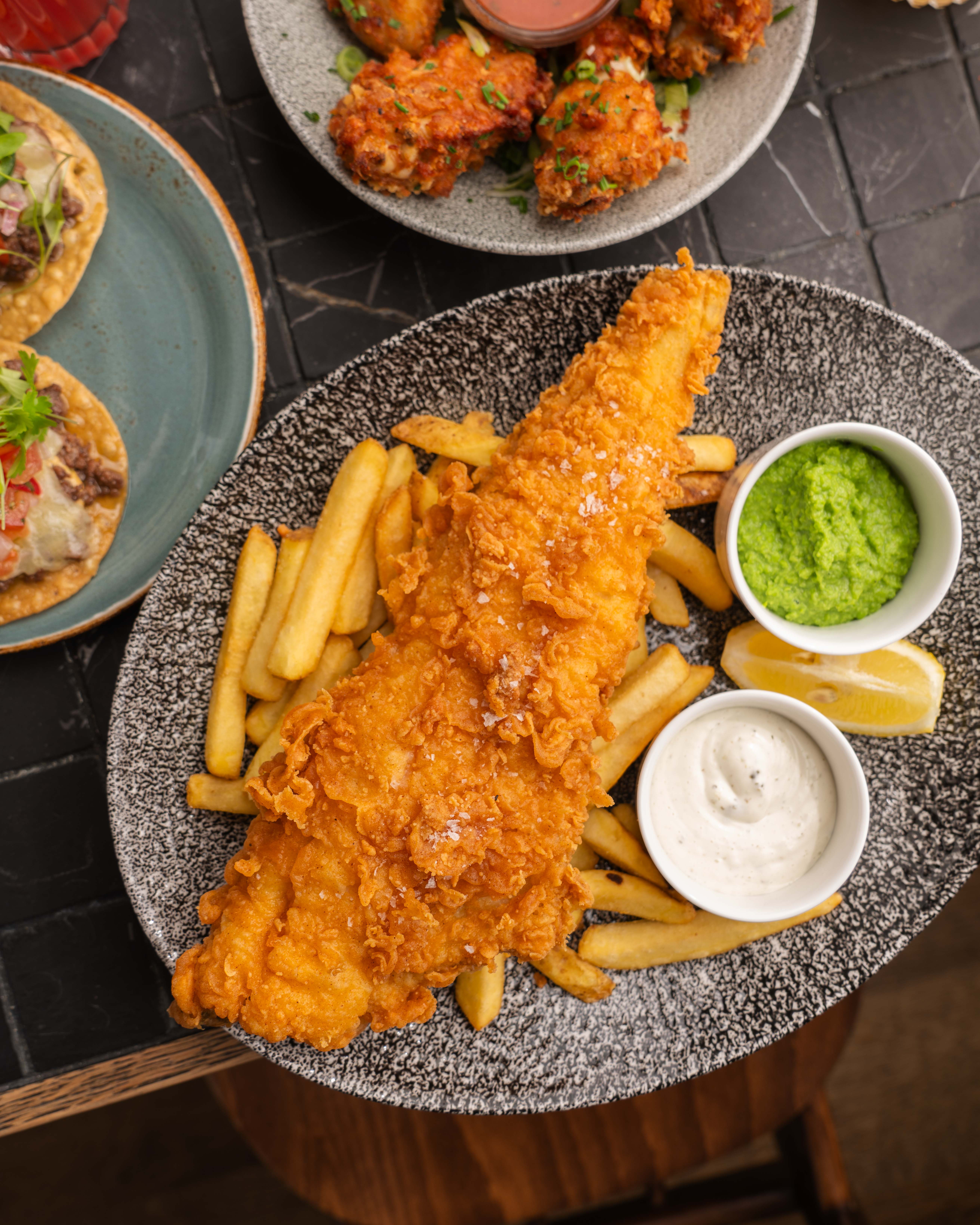 Crispy fried fish fillet with fries, ideal for networking events in Paradiso London.