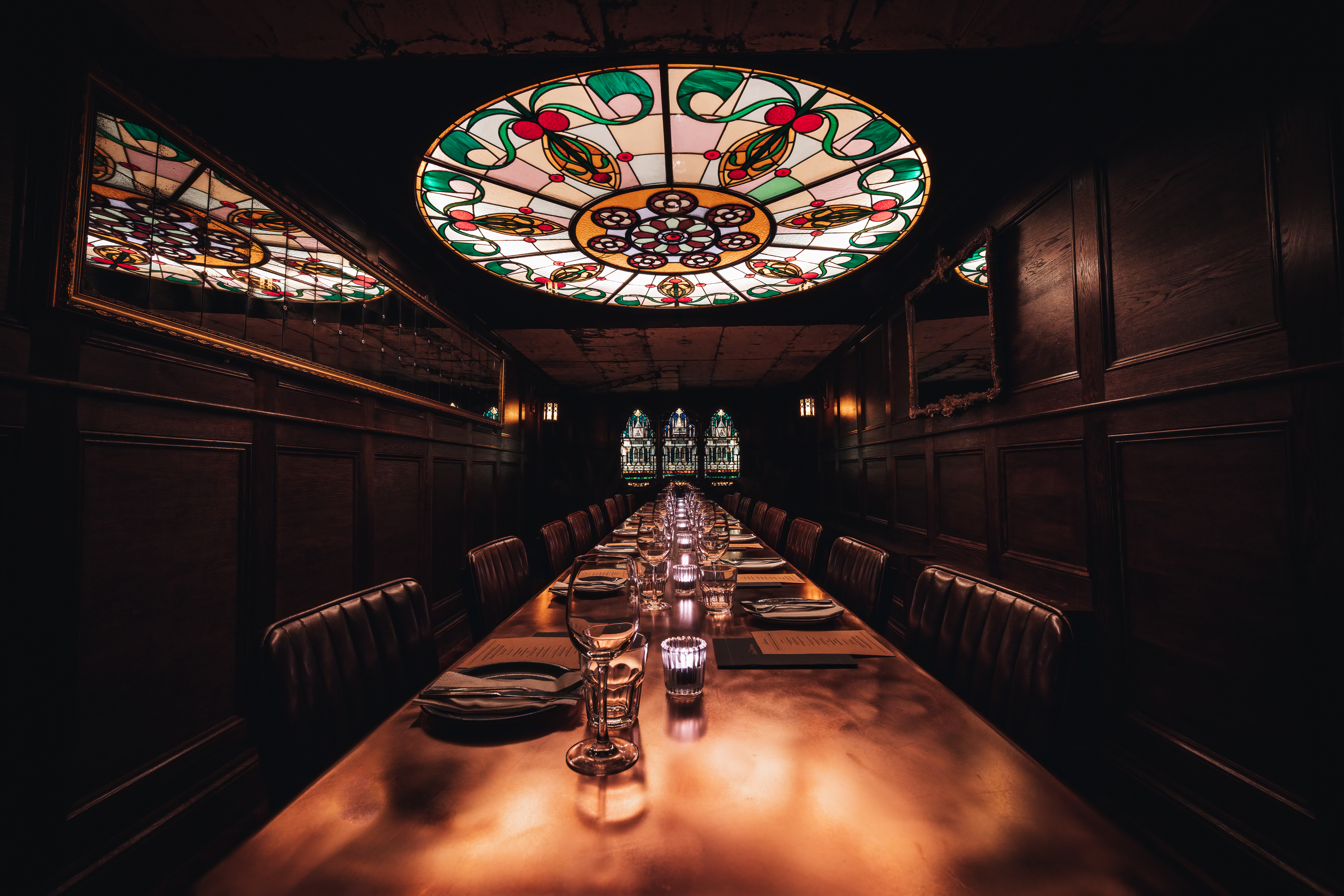 Elegant private dining room with stained glass ceiling for exclusive events in Manchester.