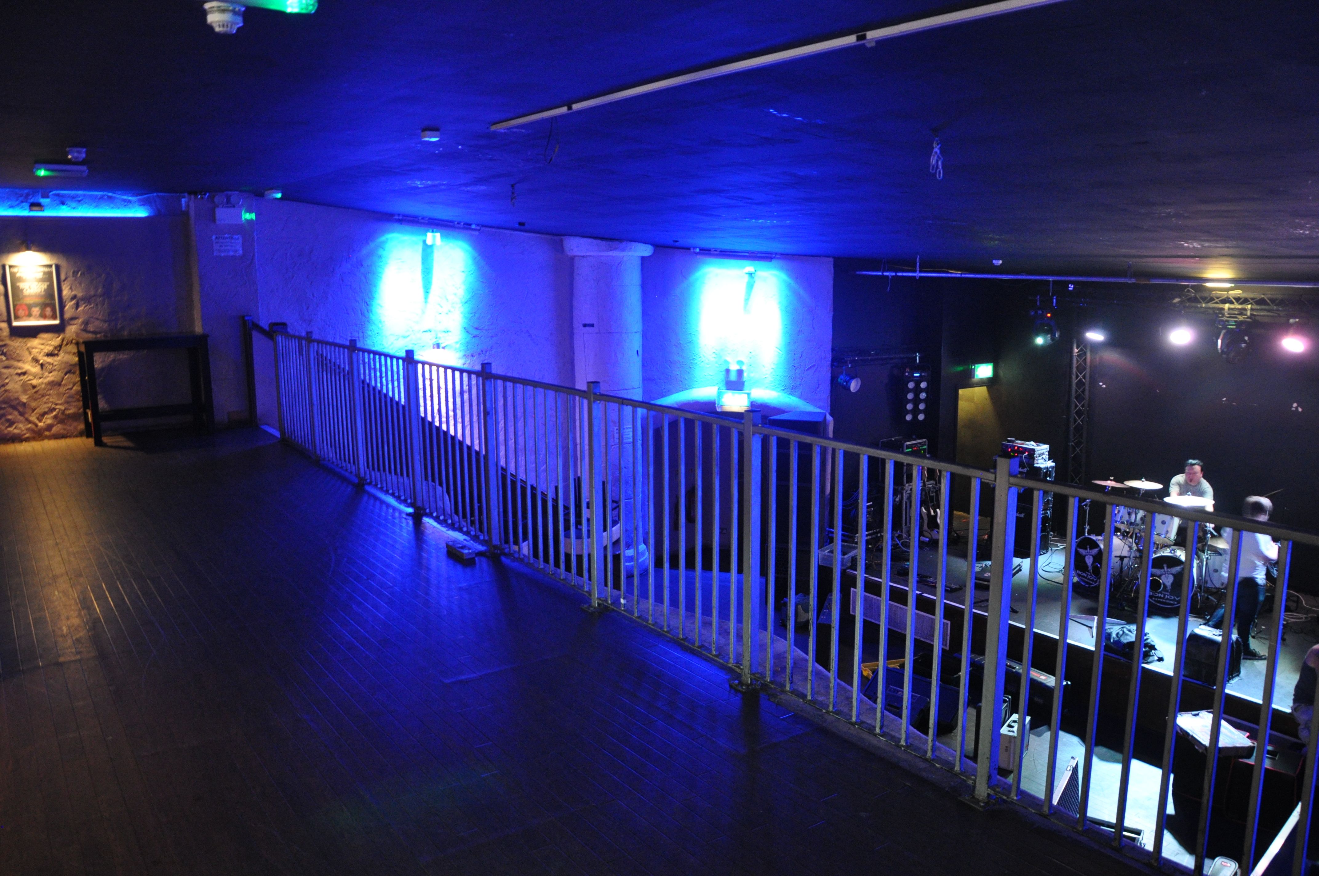 Main room at The Globe Cardiff, modern event space with blue accents for gatherings.