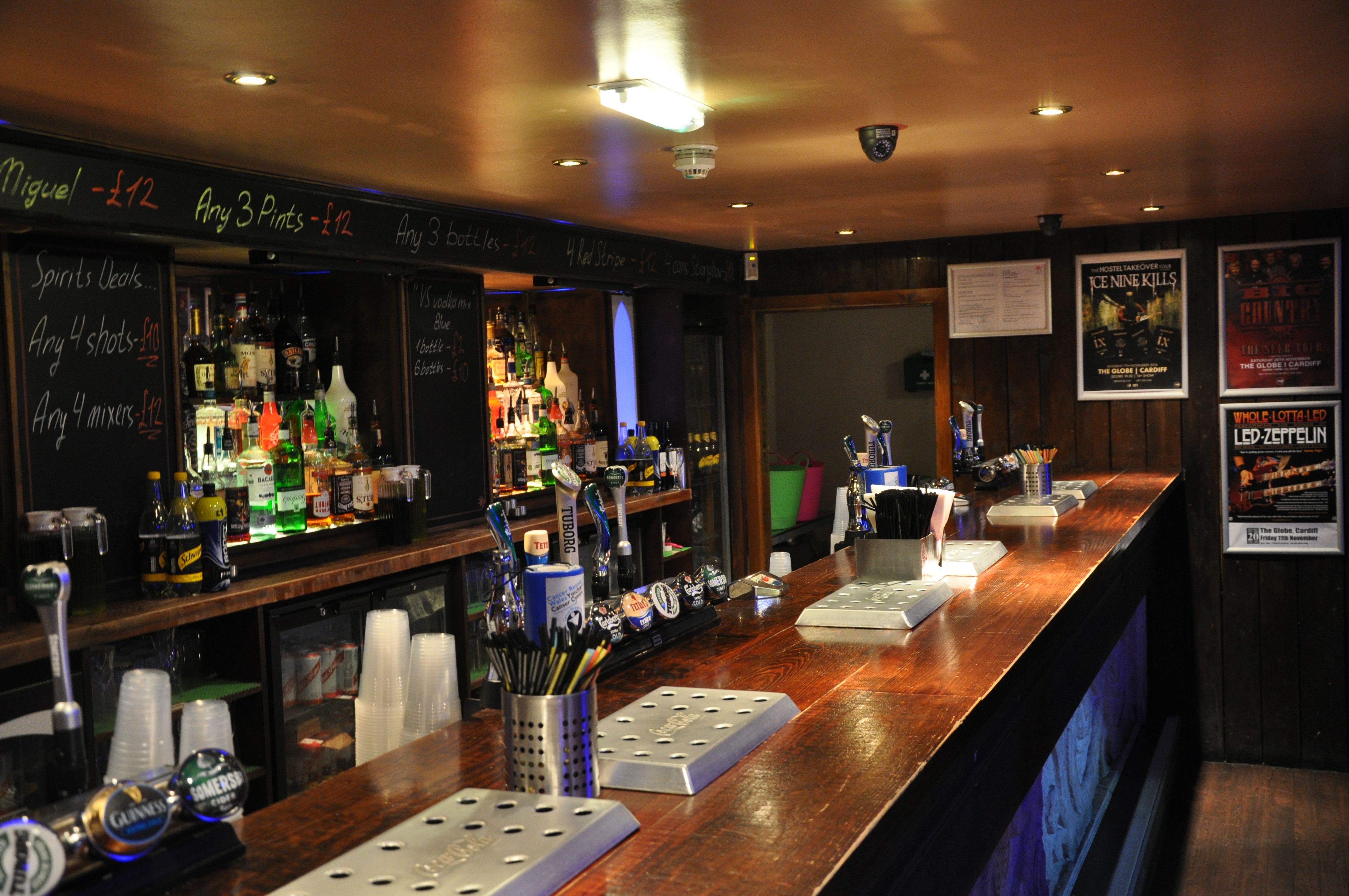 Main room bar at The Globe Cardiff, polished wood, ideal for networking events and socials.