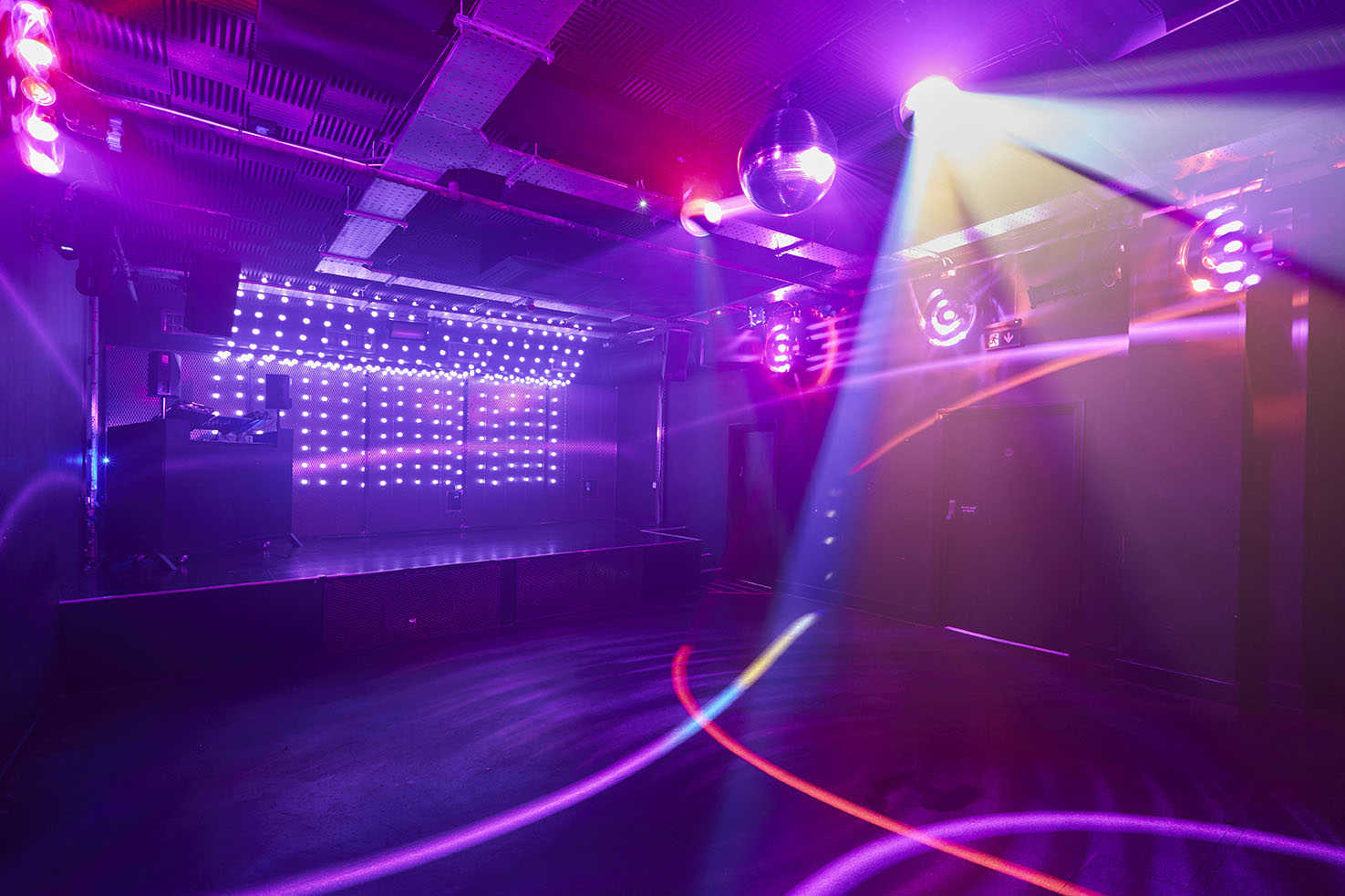 Vibrant Camden Assembly event space with colorful lighting, ideal for parties and corporate events.