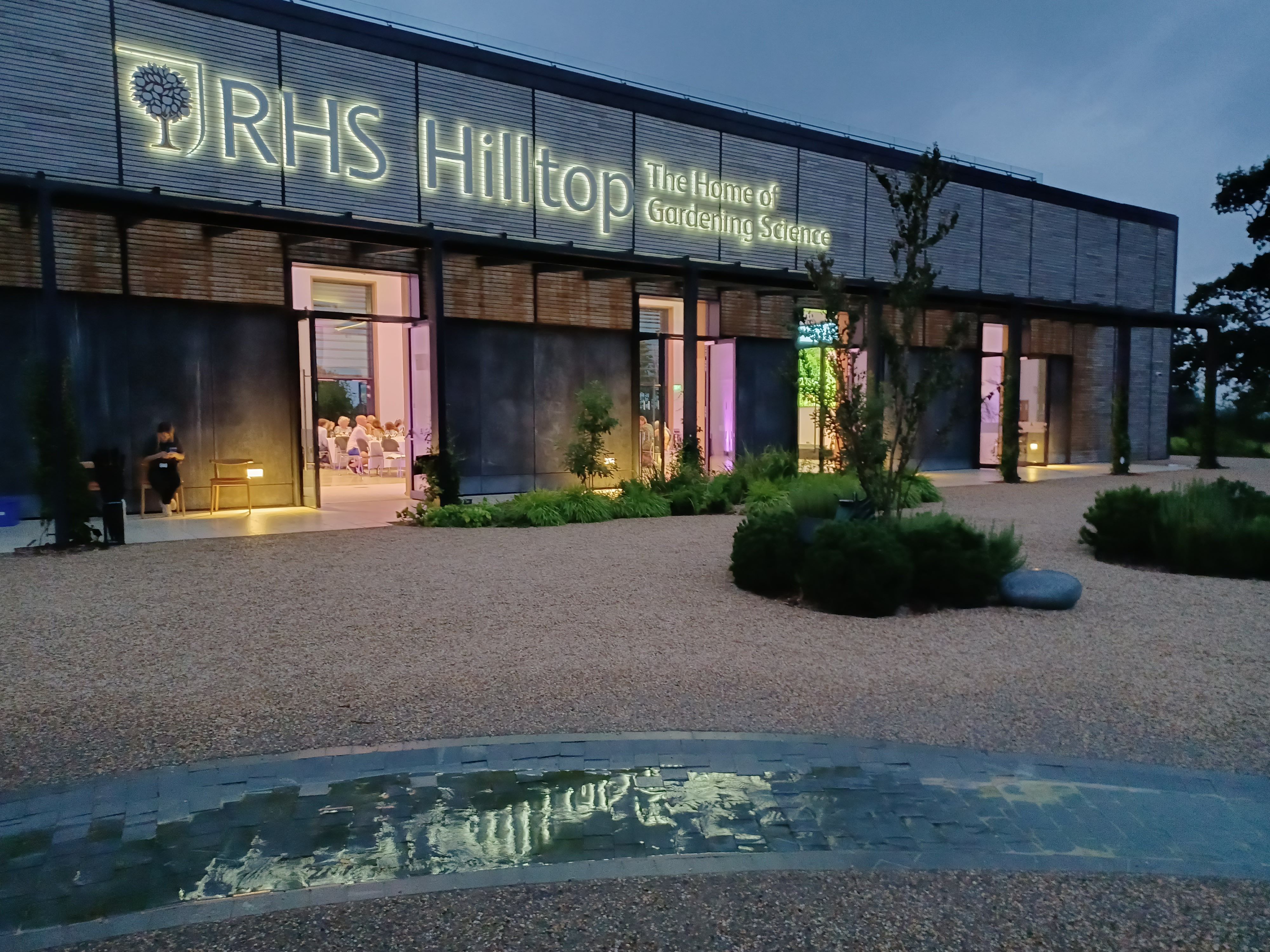 Hilltop Garden Room at RHS Wisley, modern venue with elegant lighting for events.
