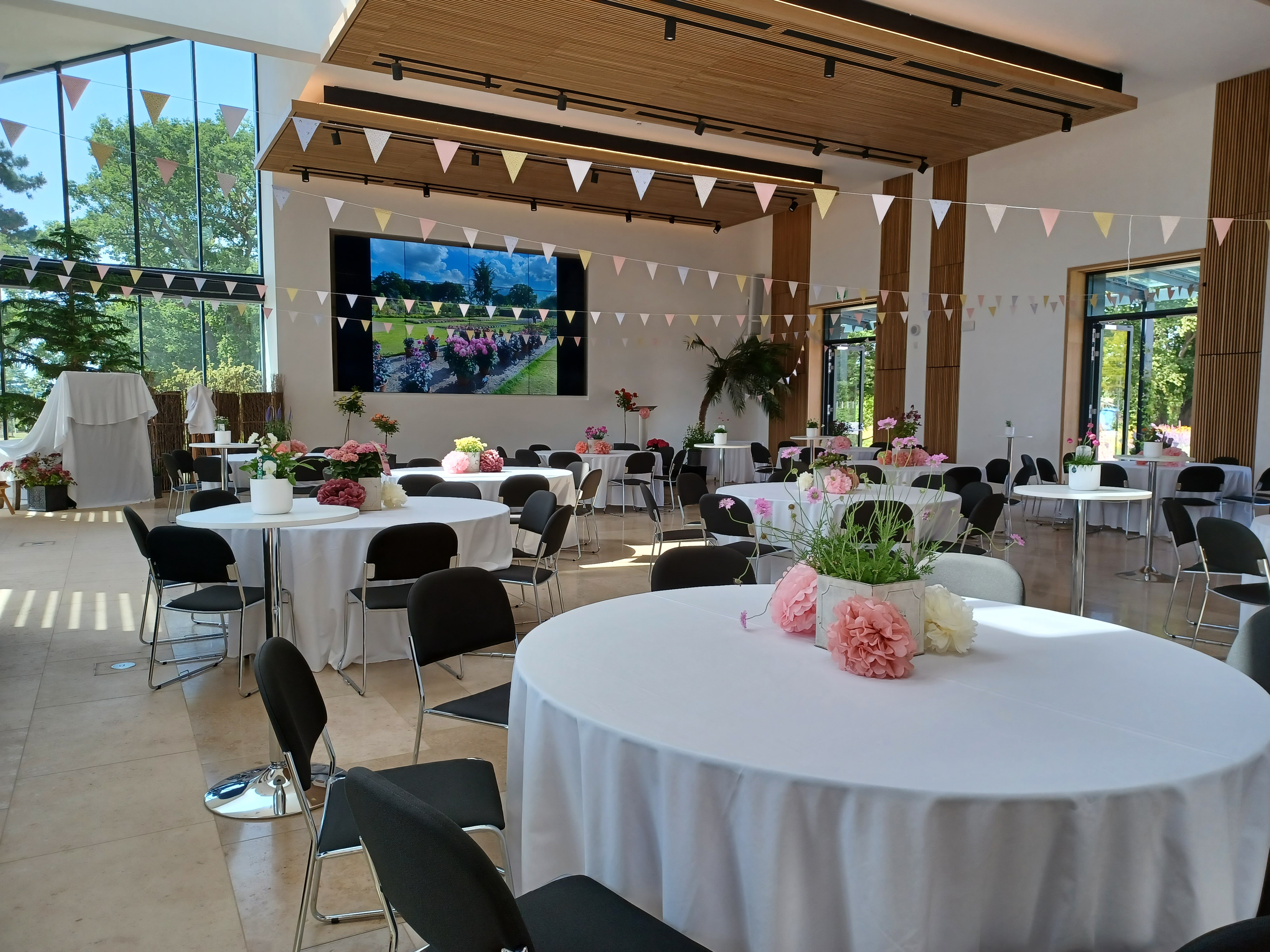 Hilltop Garden Room at RHS Wisley, elegant event space with floral decor for celebrations.