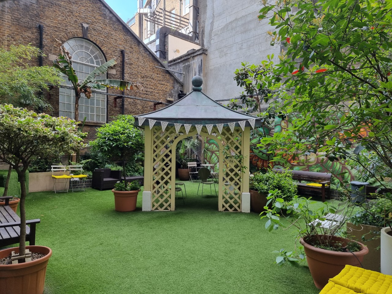 Charming outdoor venue with gazebo for intimate gatherings in Fitzrovia Community Centre.