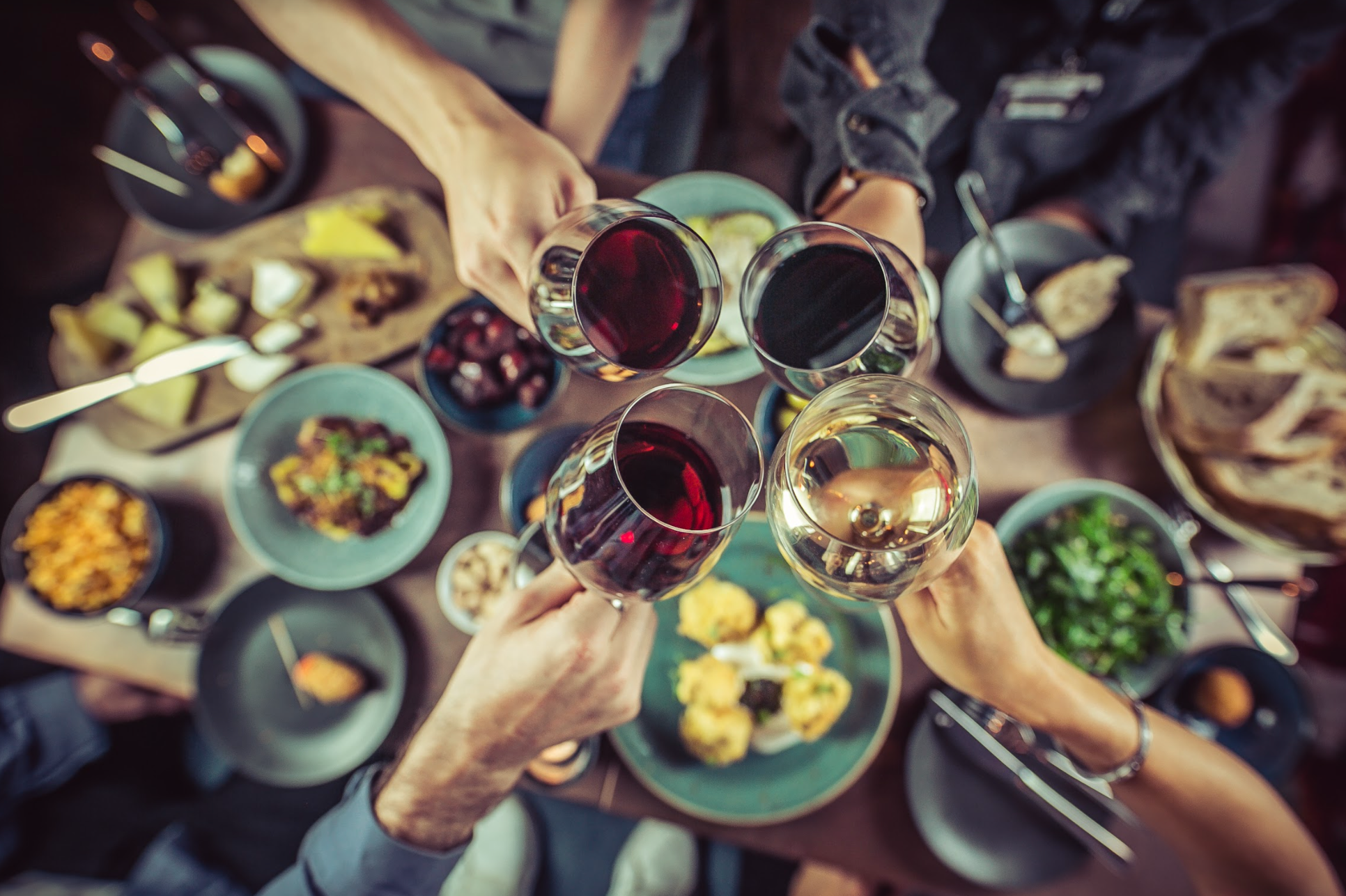 Vibrant networking event in The Private Room at VAGABOND MONUMENT with wine and diverse dishes.