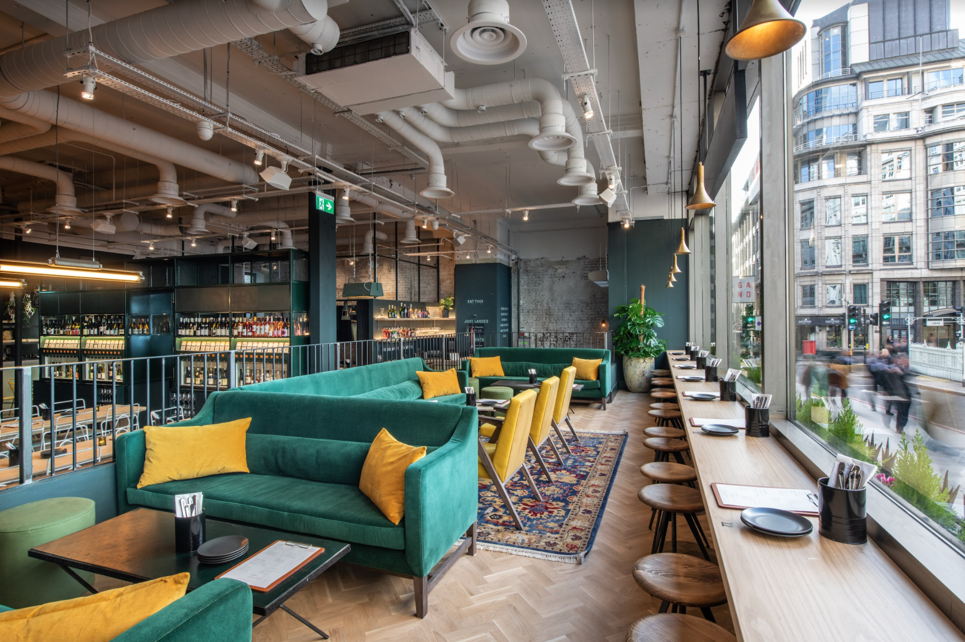 Modern lounge with vibrant seating, ideal for meetings and events in urban setting.