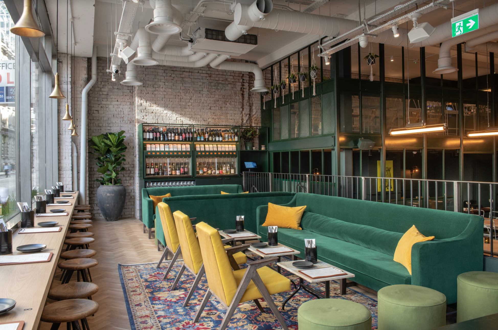 Modern lounge with vibrant green seating, ideal for casual meetings and events.