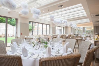 Elegant event space at The Hoste Arms with fine table settings for weddings and gatherings.