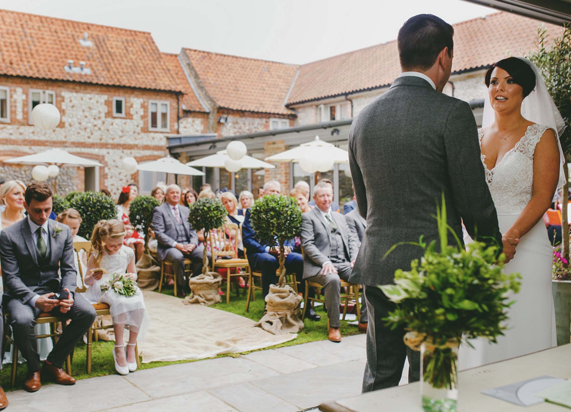 Outdoor wedding ceremony at The Hoste Arms with elegant decor and greenery.