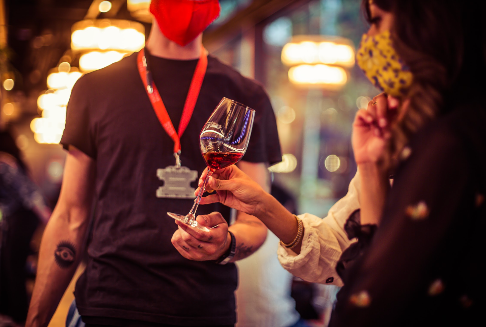 Vibrant networking event at Vagabond Shoreditch with wine and safety measures.