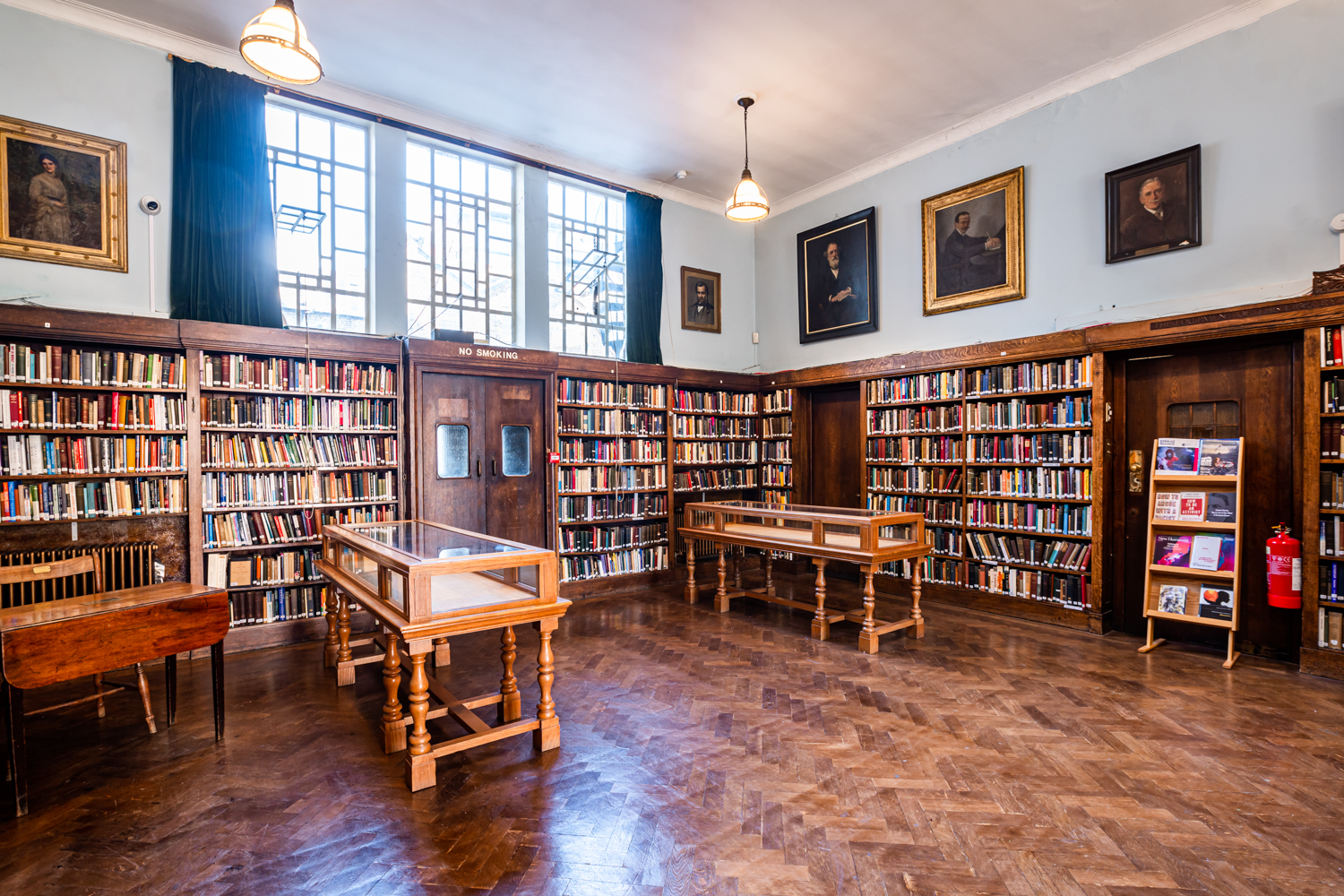 Spacious Conway Hall library with warm wood tones, ideal for meetings and workshops.