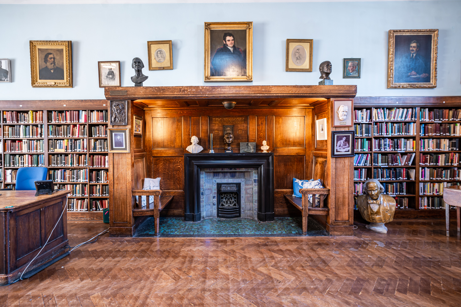 Sophisticated library in Conway Hall with warm wood paneling, ideal for intimate events.