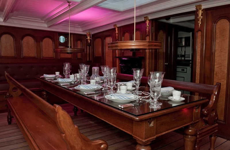 Elegant dining table in vintage Masters Saloon, perfect for upscale events and gatherings.