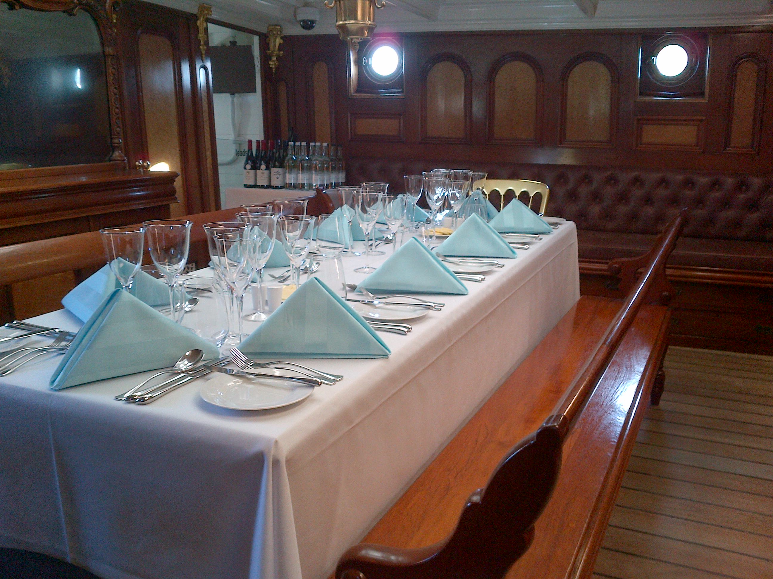 Elegant dining table setup at Masters Saloon, ideal for corporate dinners and events.