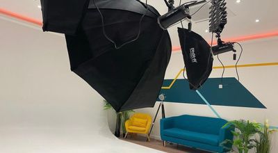 Photography studio with professional lighting for virtual events and video productions.