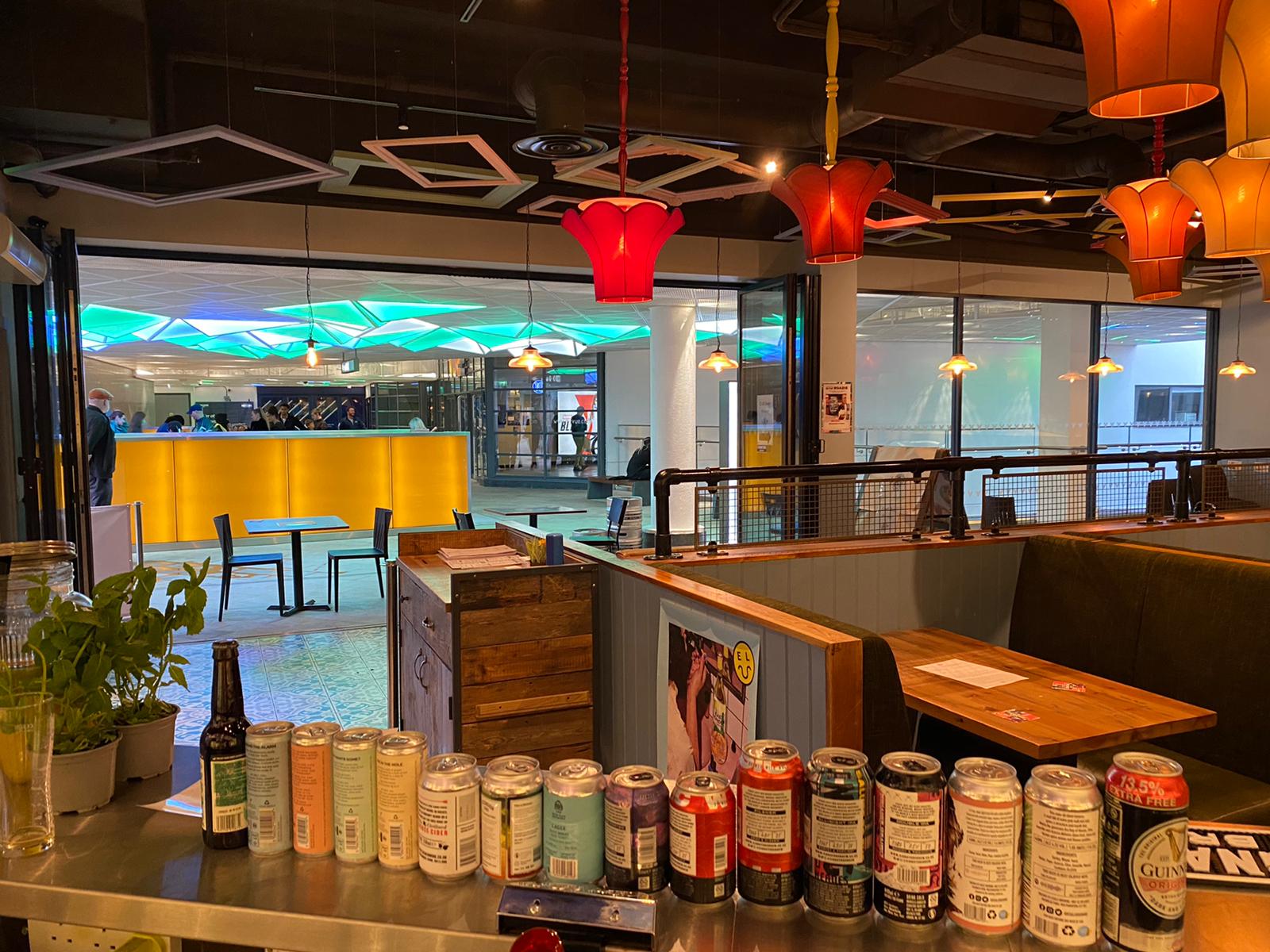 LDN Craft bar event space with vibrant lighting, perfect for mixers and casual gatherings.